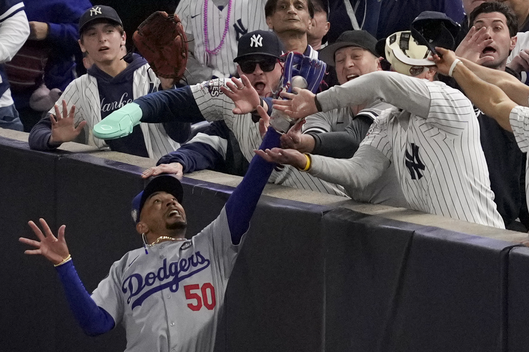 Yankee Stadium fan ejected for prying ball out of Mookie Betts' glove at  World Series