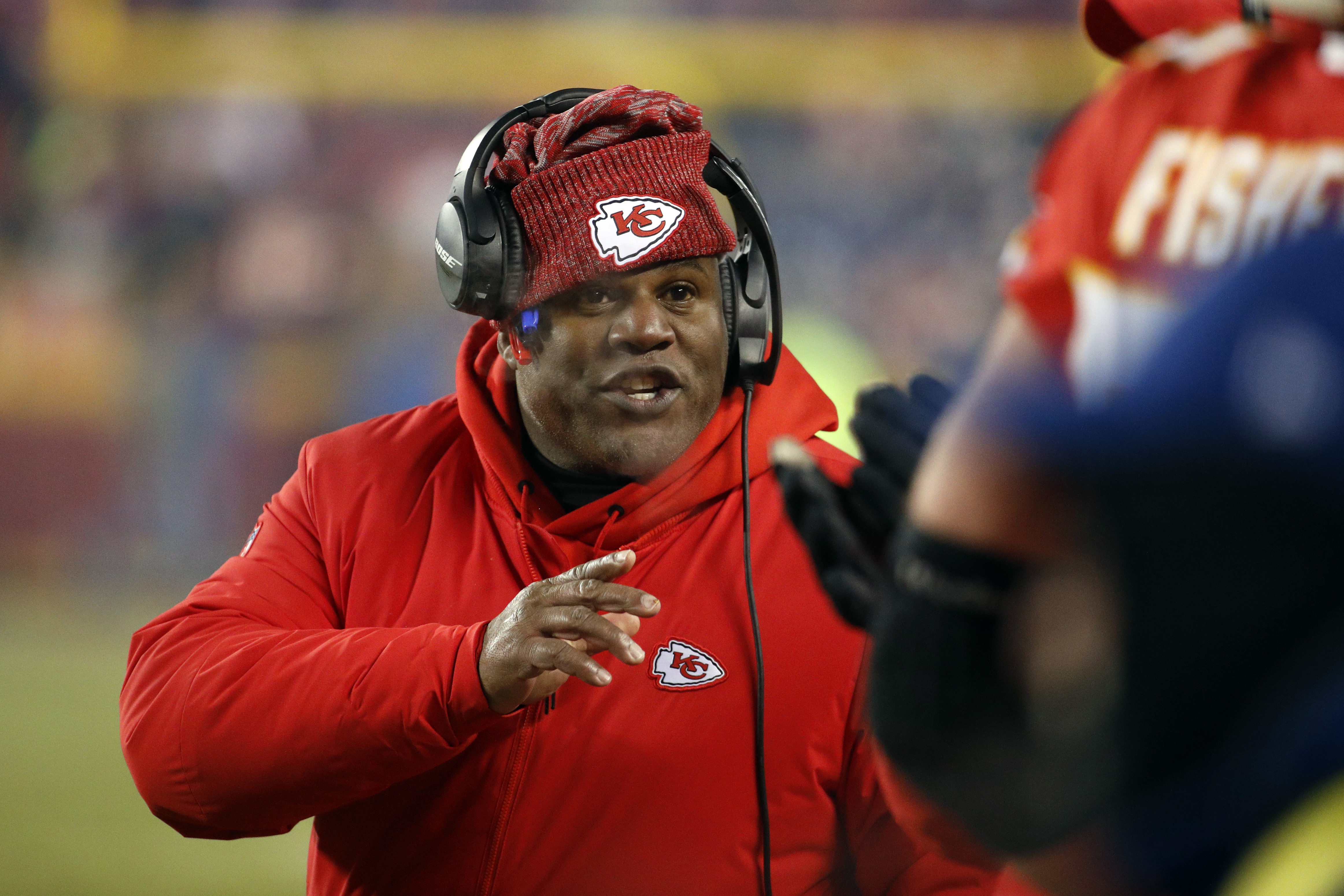 Kansas City Chiefs offensive coordinator Eric Bieniemy talks to