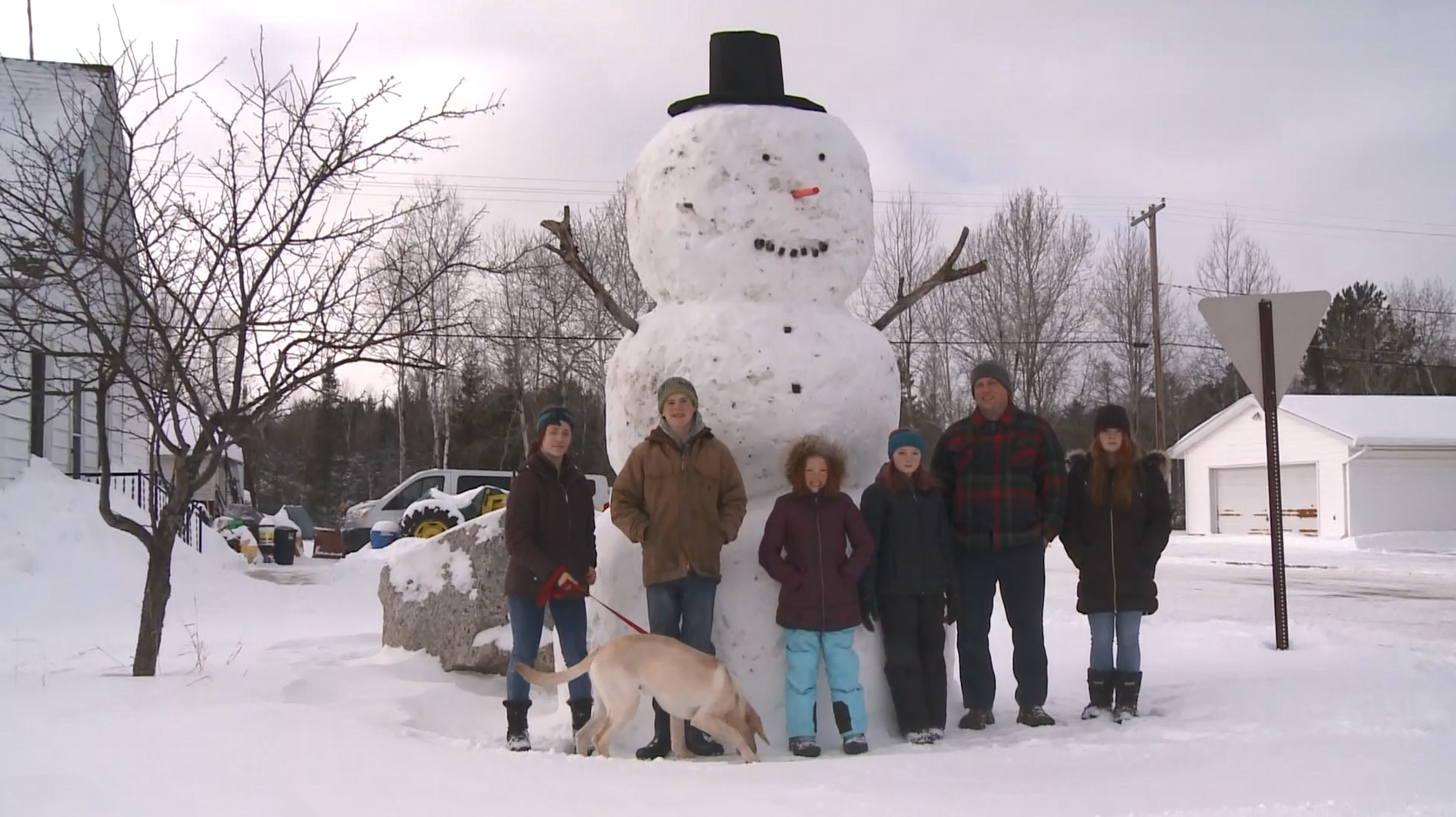 Family builds giant snowman in their front yard