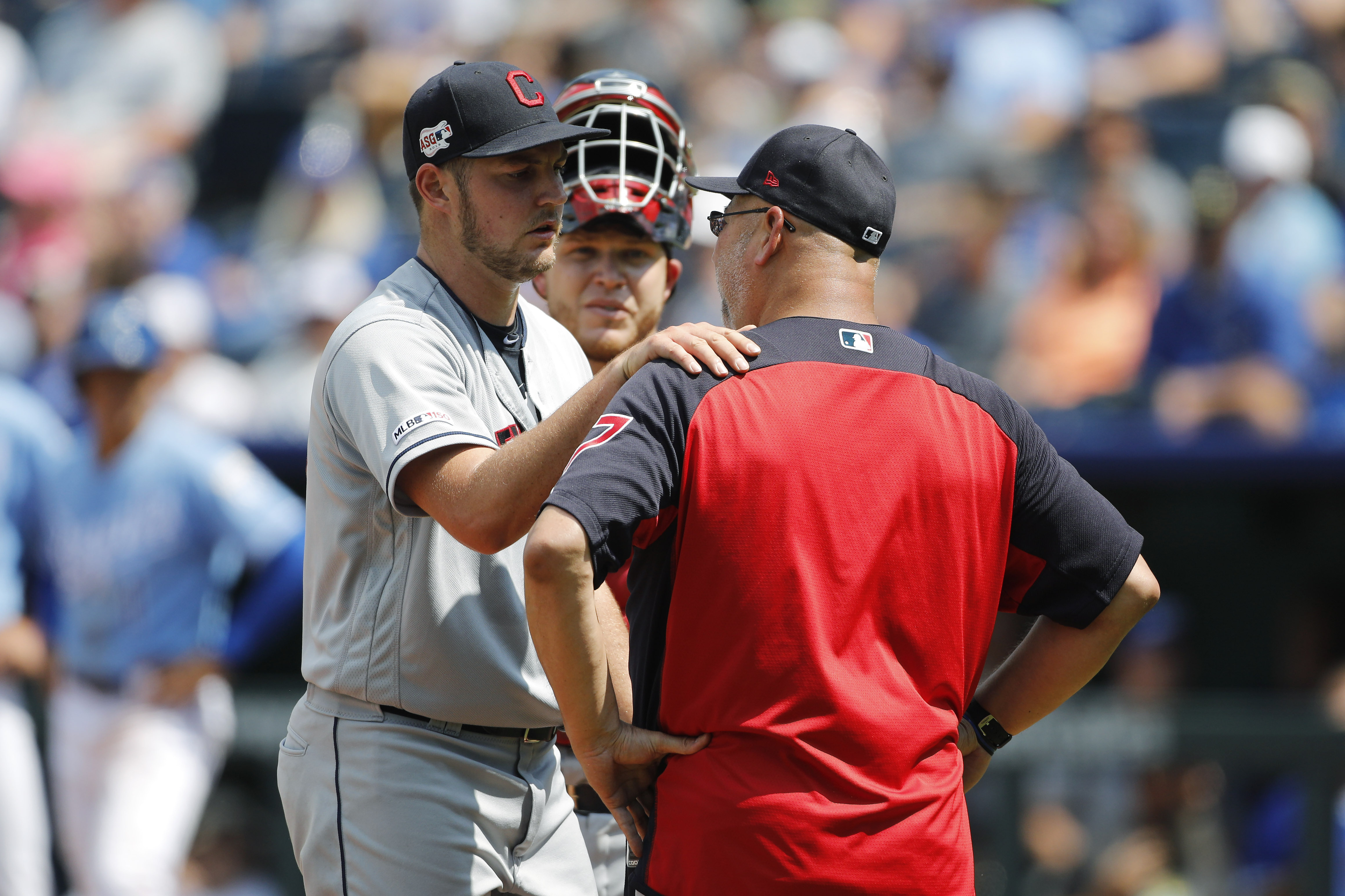 Long toss: Indians pitcher Trevor Bauer throws ball over center-field fence