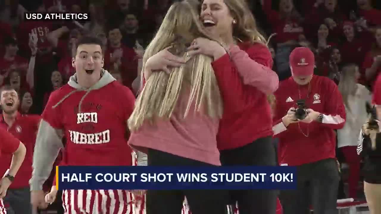 Woman hits half court shot, gets proposal from Dunkin' Donuts