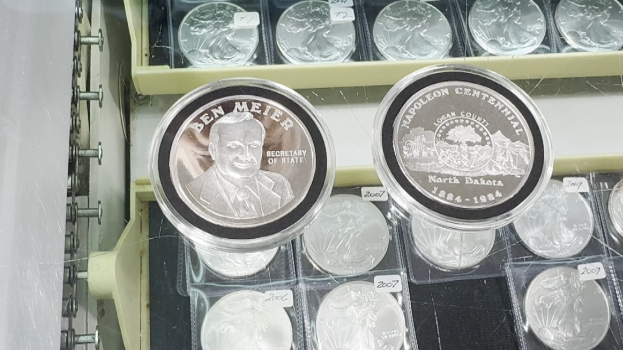 Old silver coin showcases past Secretary of State