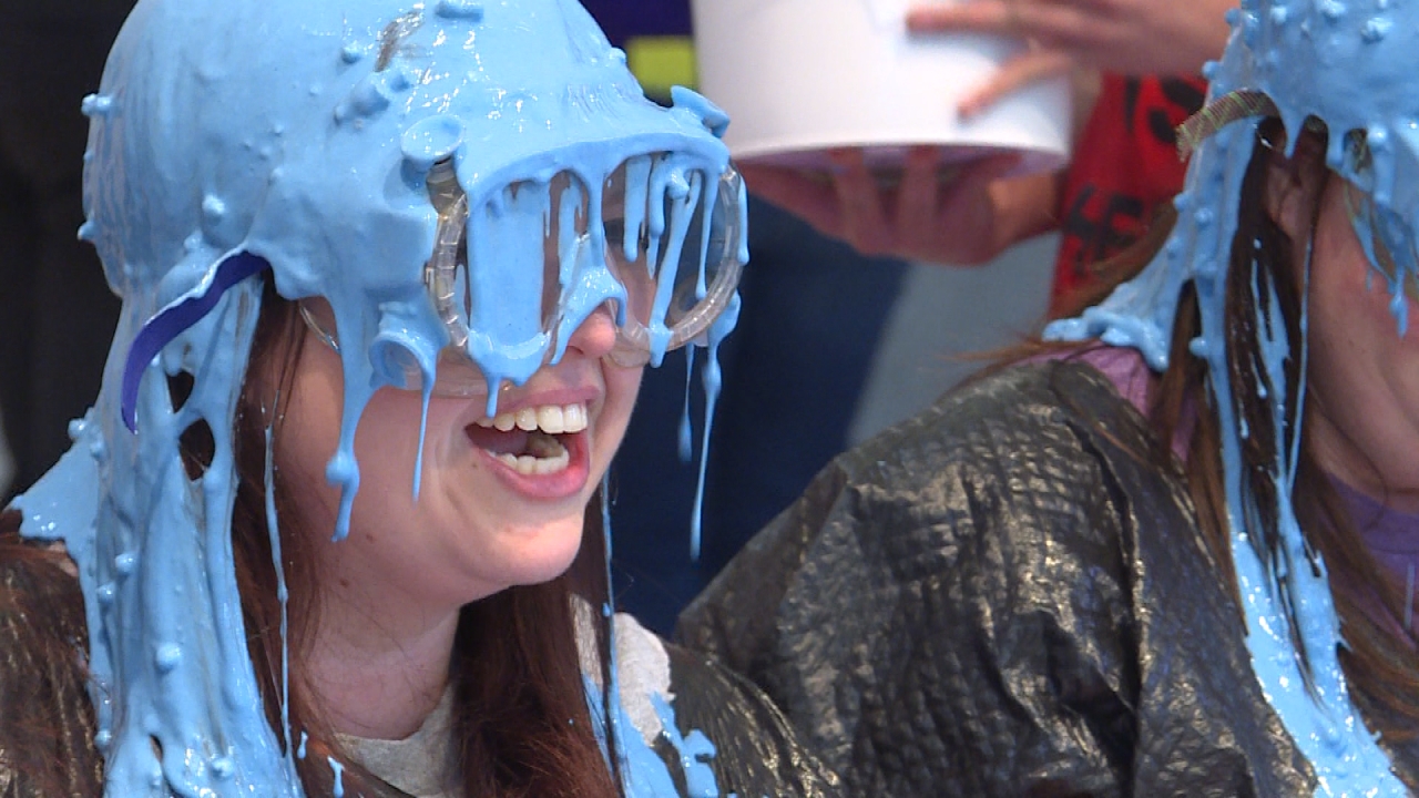 Teachers get slimed as students raise money for backpack program