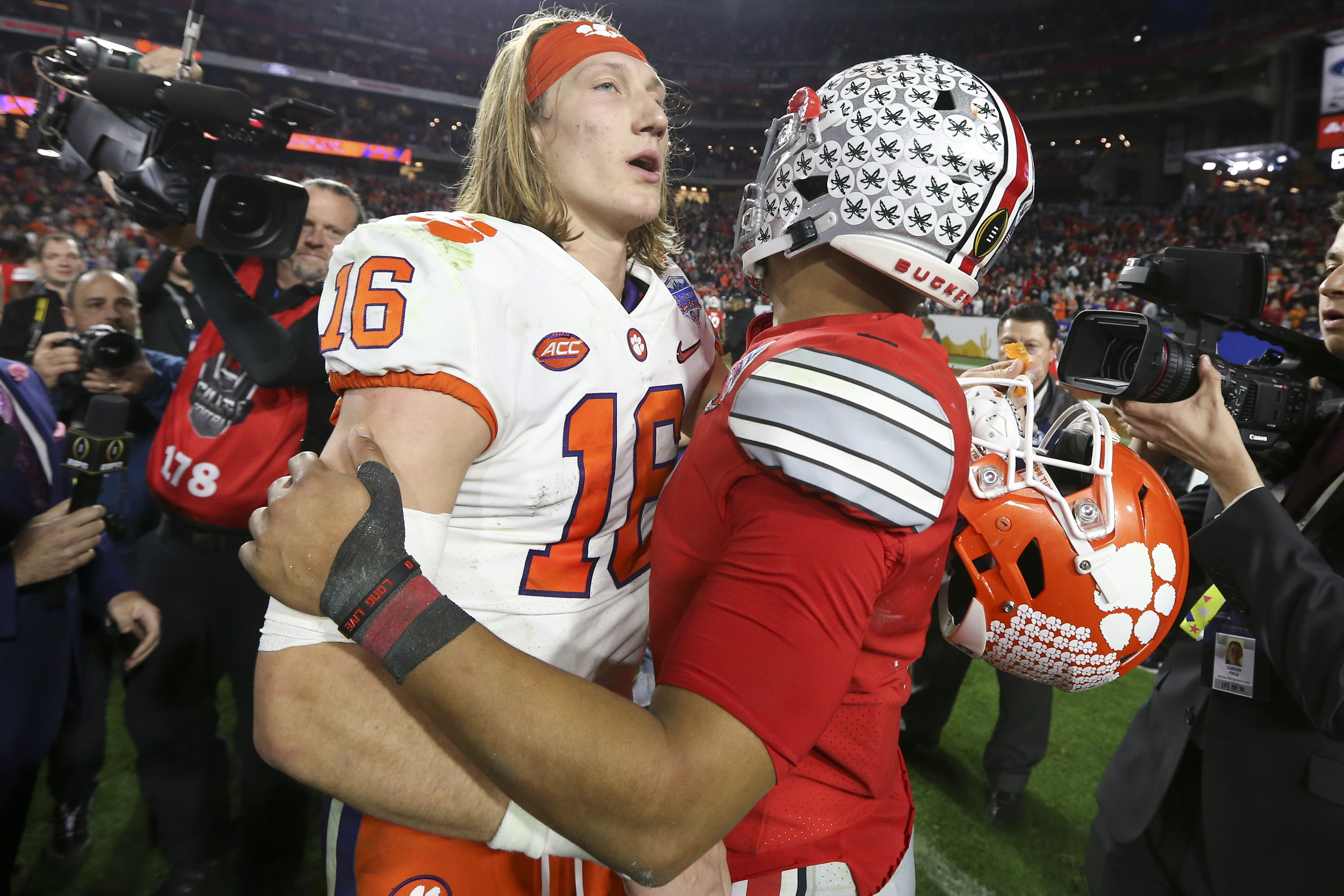 Download Ohio State quarterback Justin Fields delivers a pass