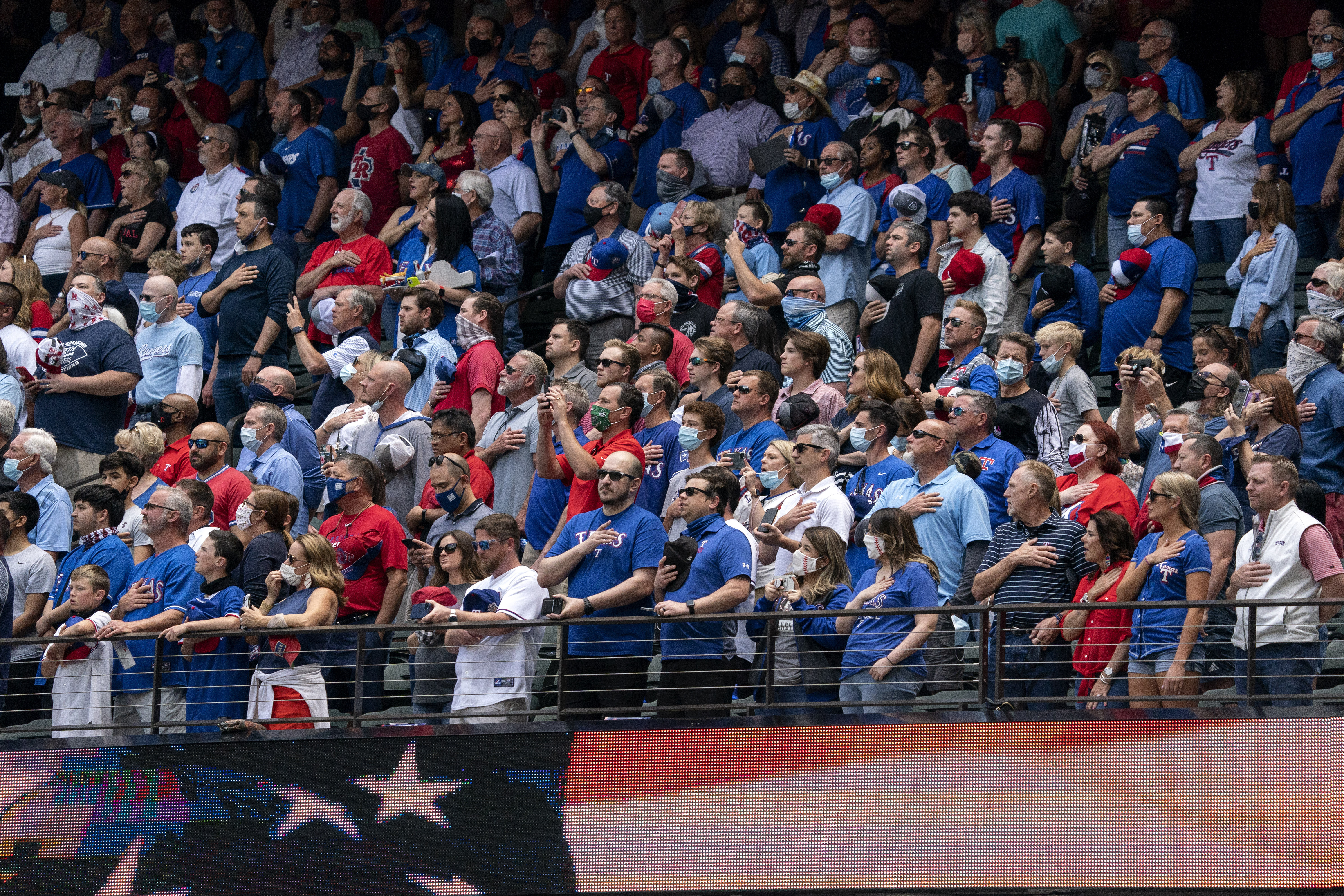 Texas Rangers fill stands with fans, who accept 'calculated risk