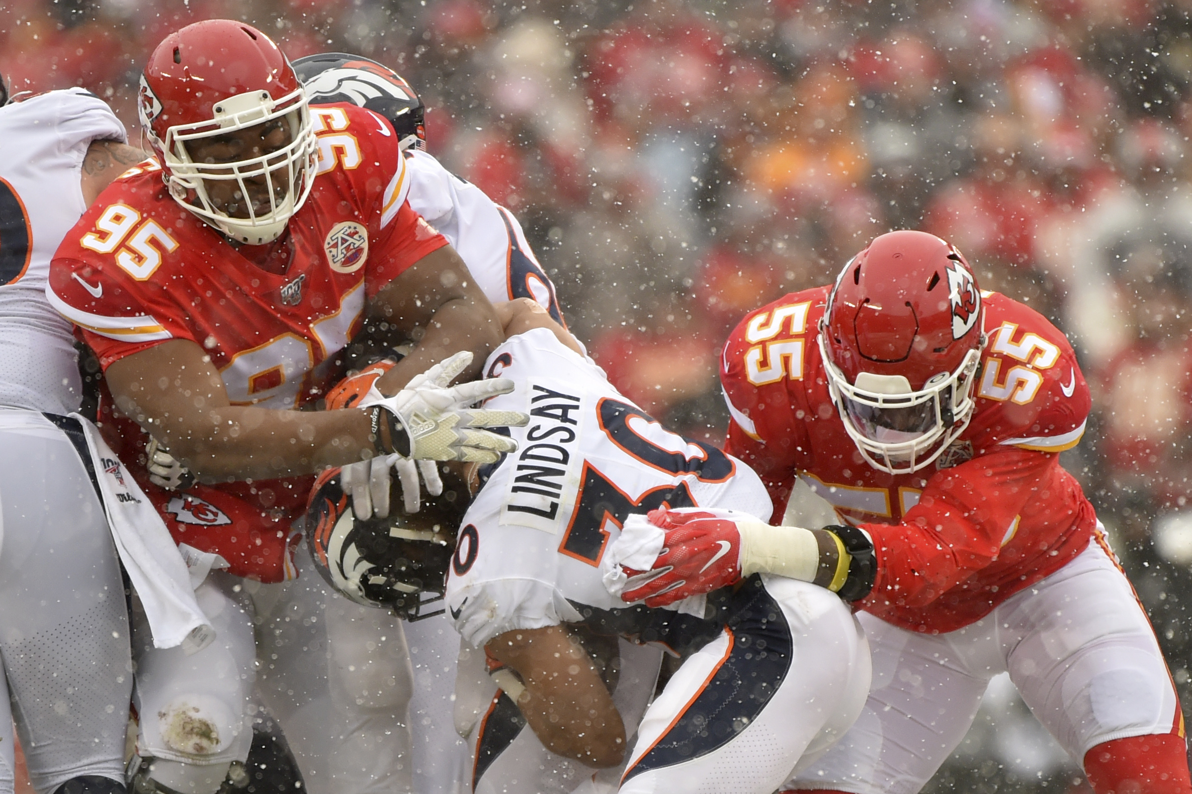 Kansas City Chiefs defensive end Frank Clark (55) rushes during a