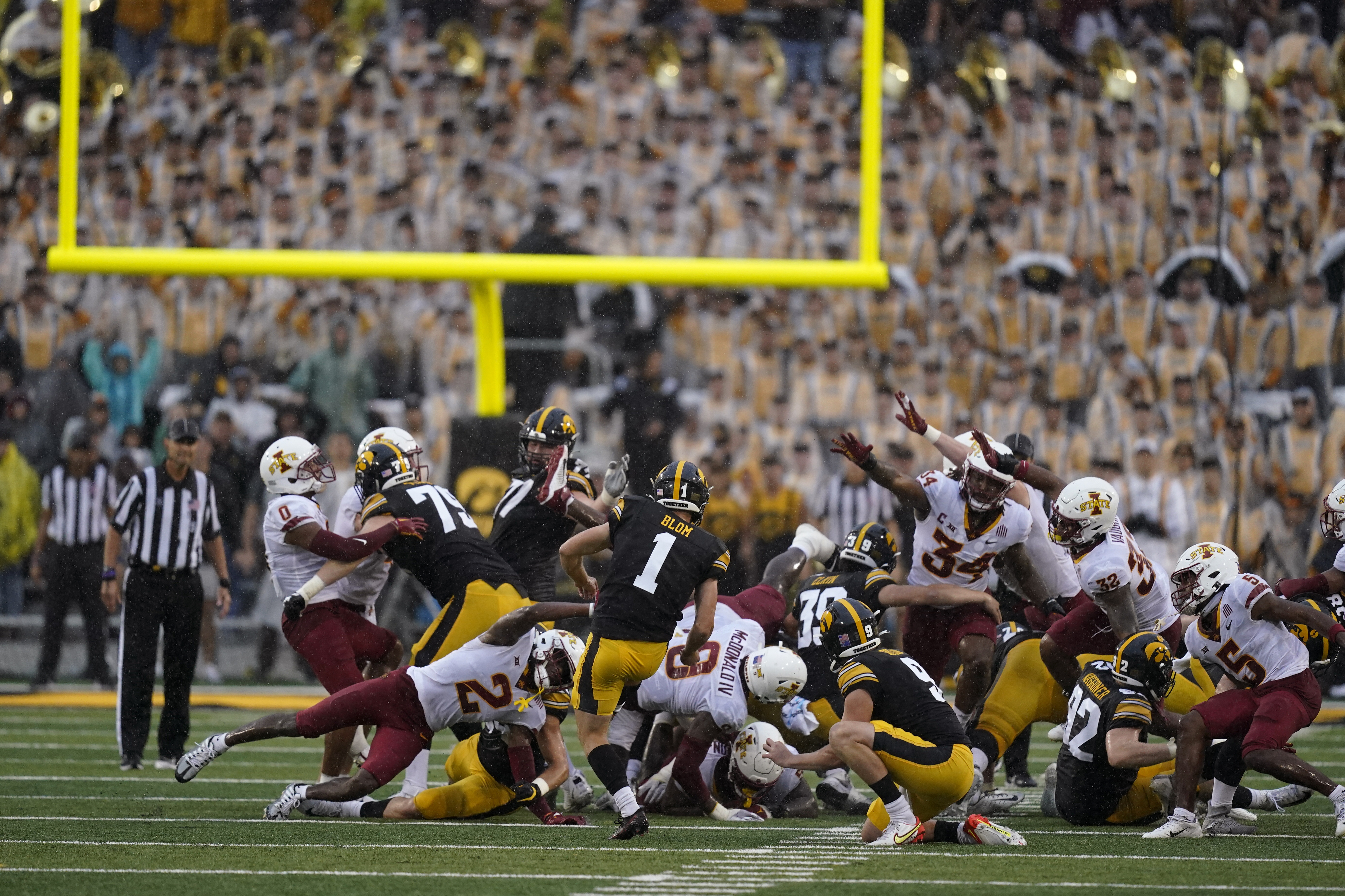 Iowa kicker charged in gambling sting allegedly won a bet on the