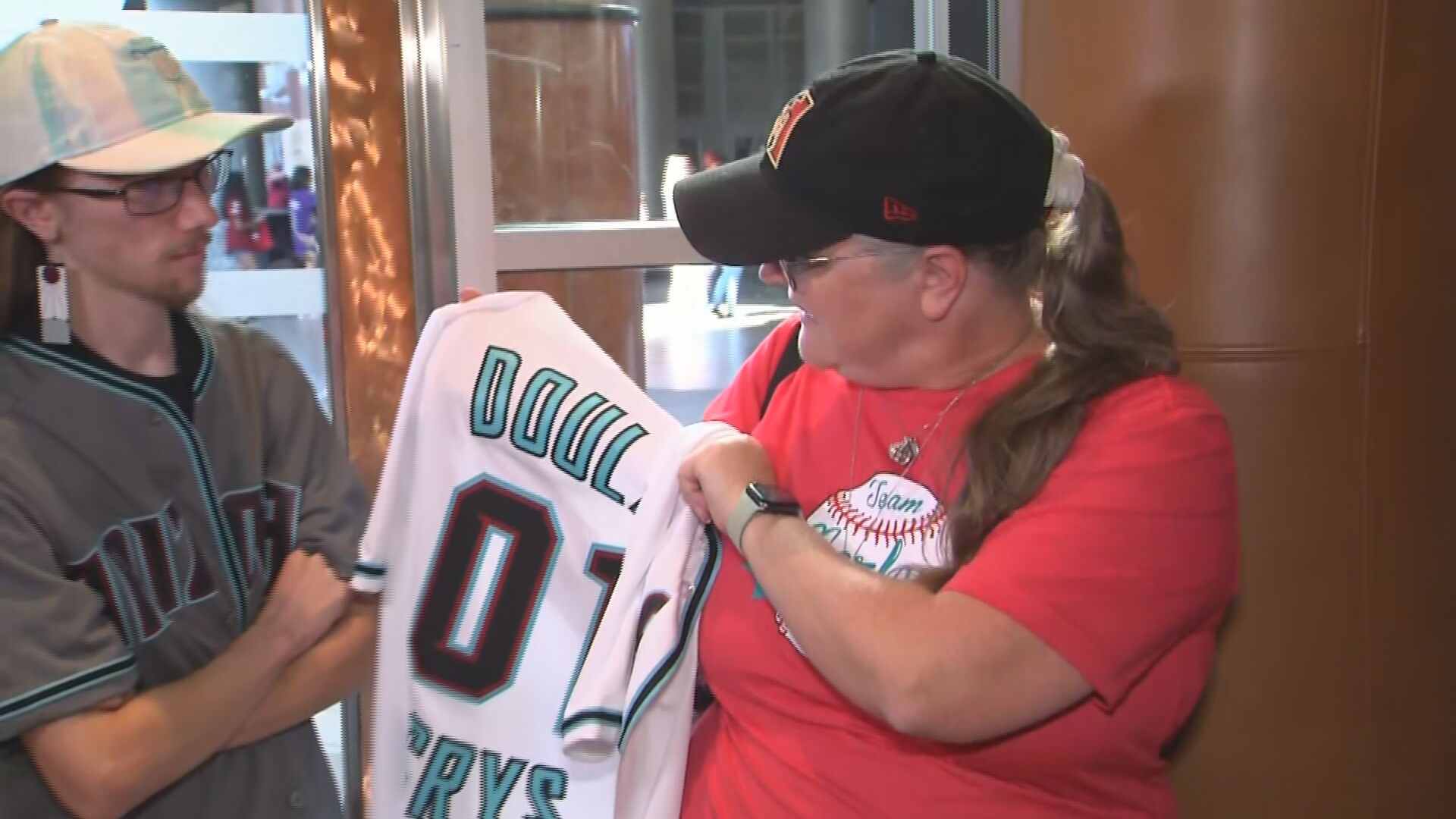 Video: TV-Visible Dodgers Fan Forced To Wear Diamondbacks Attire At Chase  Field - CBS Los Angeles