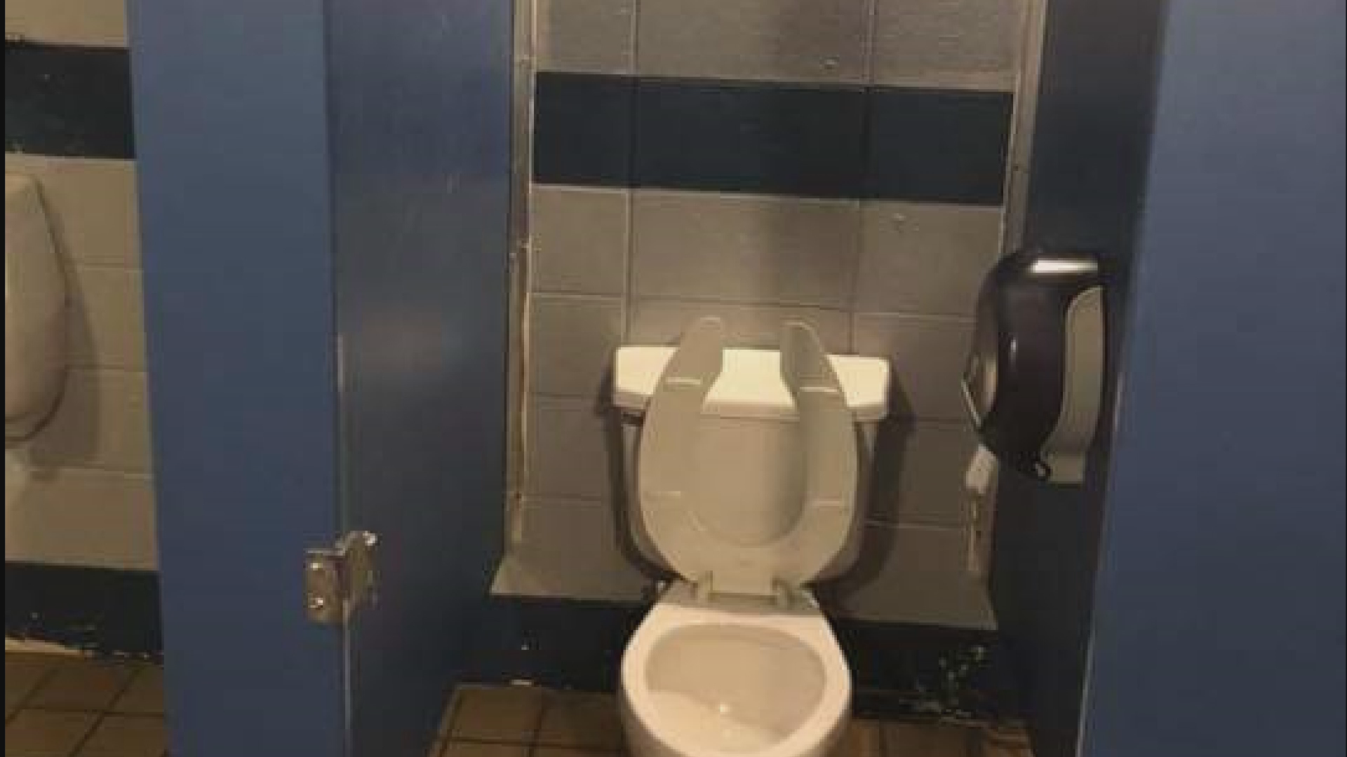 guy on toilet stall