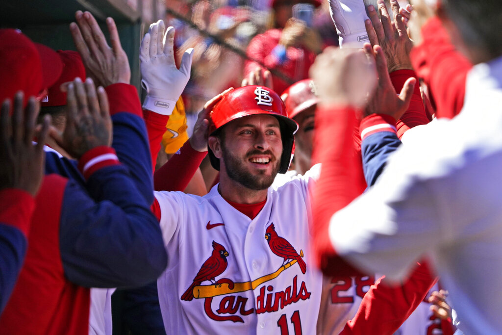 Chicago Cubs' Ben DeLuzio, right, celebrates after his run scored