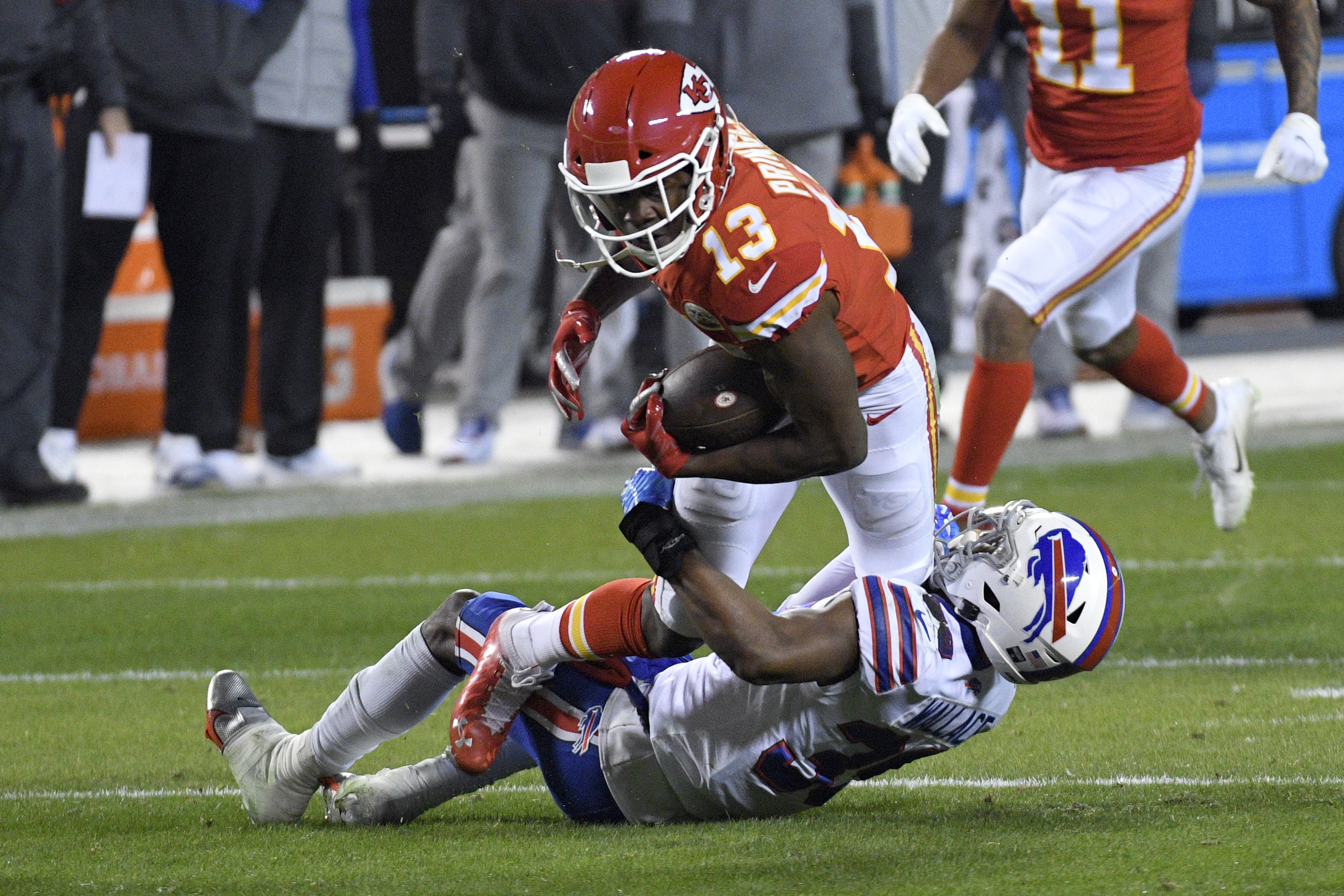 Kansas City Chiefs wide receiver Byron Pringle (13) is tackled by