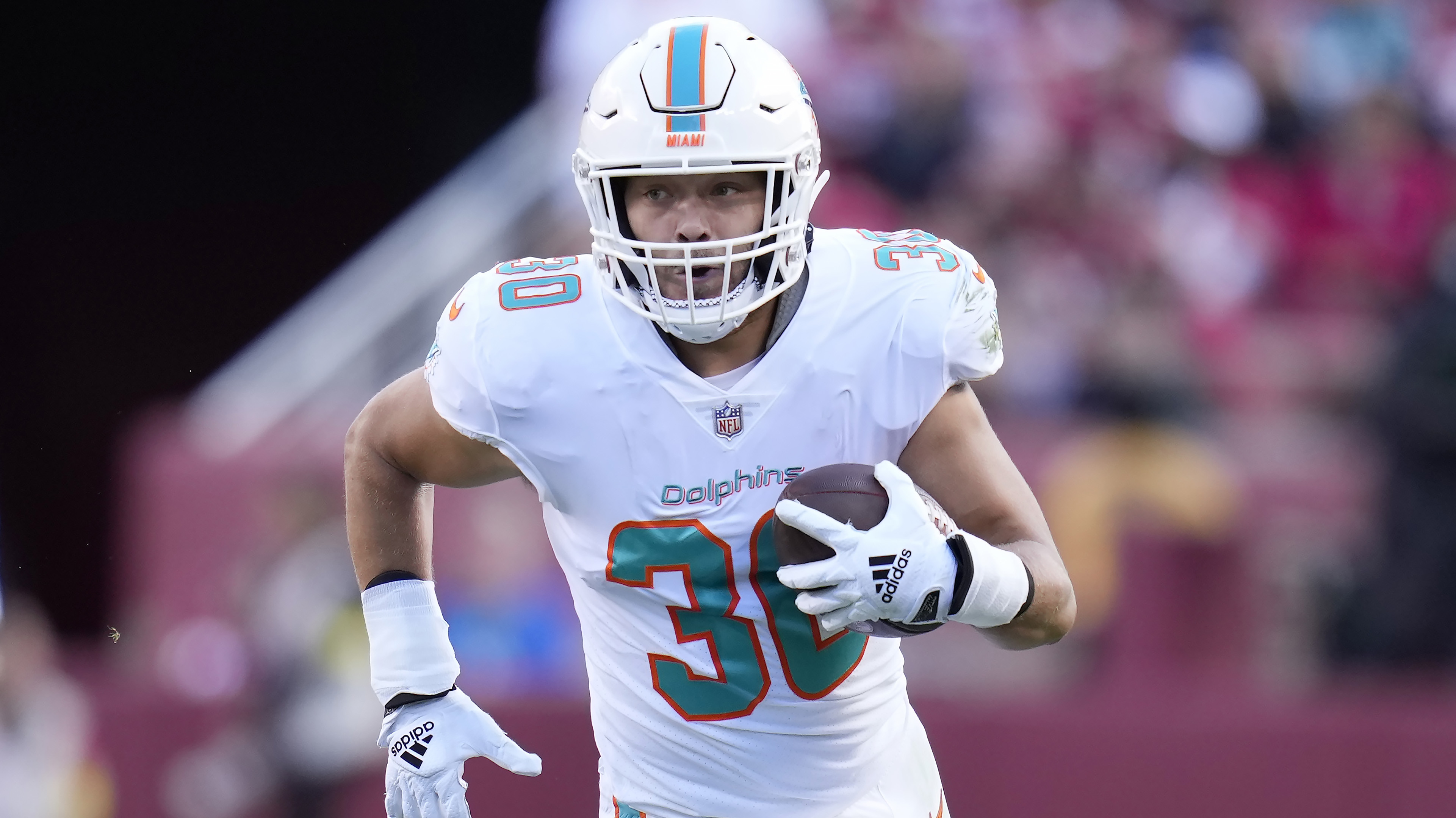 Miami Dolphins fullback Alec Ingold (30) runs a play during an NFL