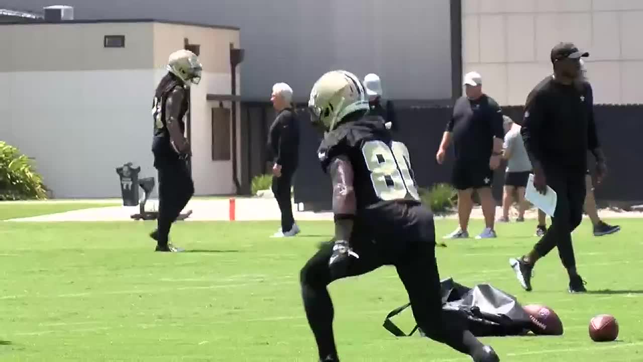 New Orleans Saints first round draft pick, wide receiver Chris Olave (12),  high fives quarterback Jameis Winston (2) during an NFL football practice  in Metairie, La., Thursday, June 2, 2022. (AP Photo/Gerald