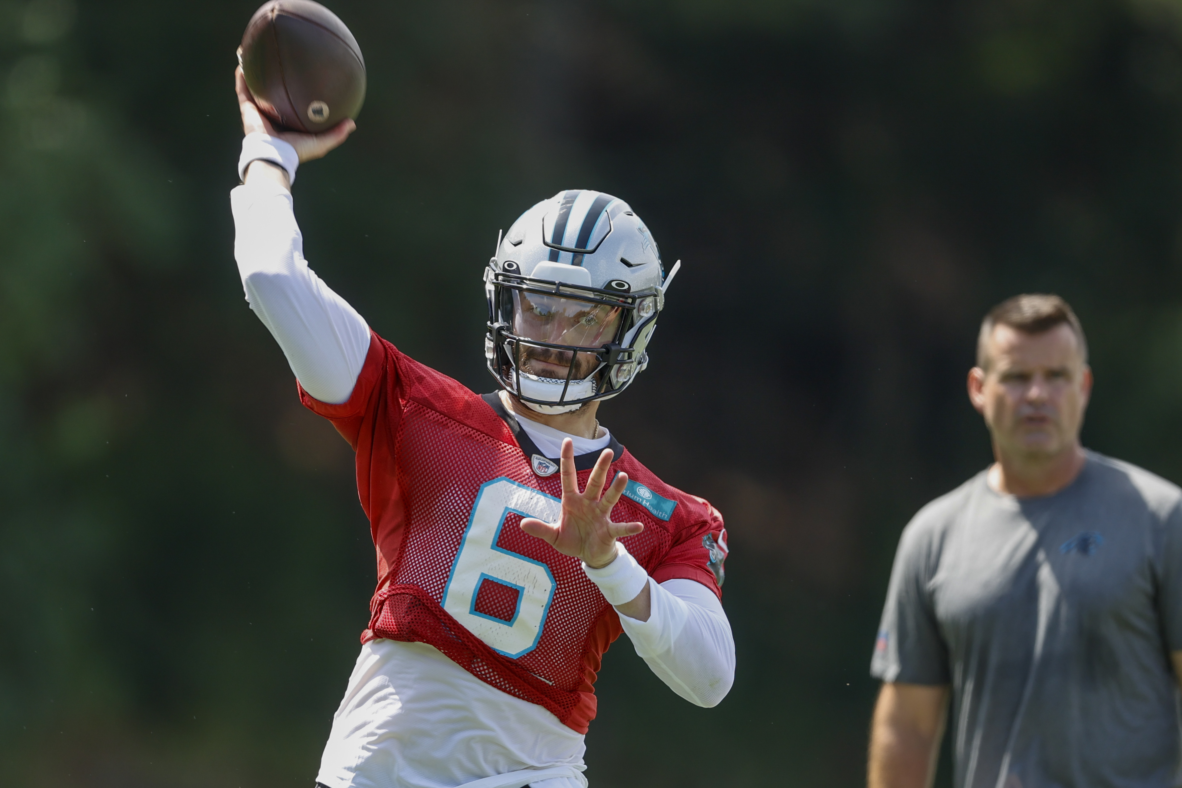 Baker Mayfield teaching Matt Corral at camp