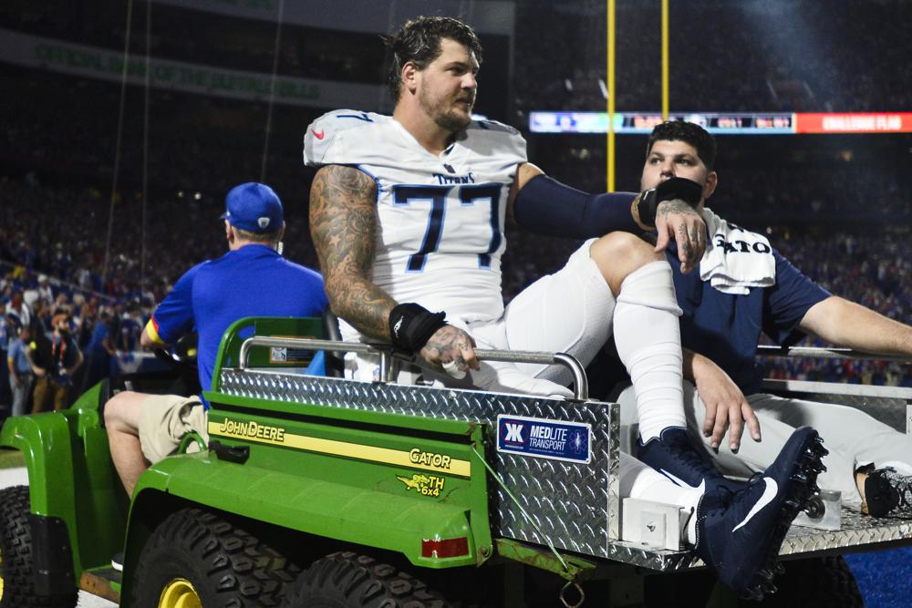 Titans star Taylor Lewan taken off field on stretcher