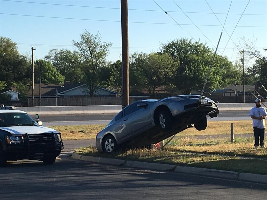 Car loses control, lands on guy wire at S. Loop 289 access road and Ave. W