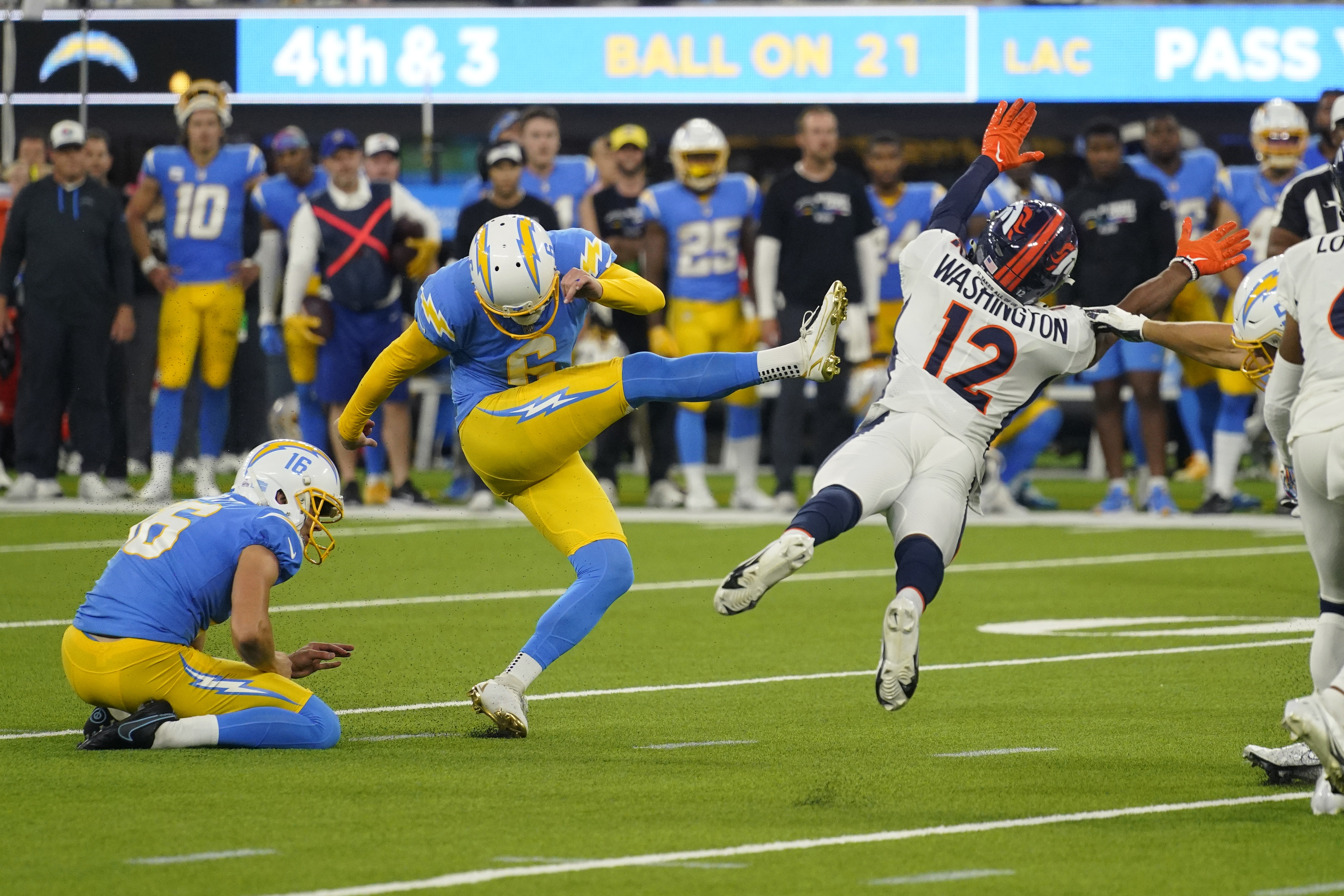 Chargers running back Joshua Kelley scrambles in the second