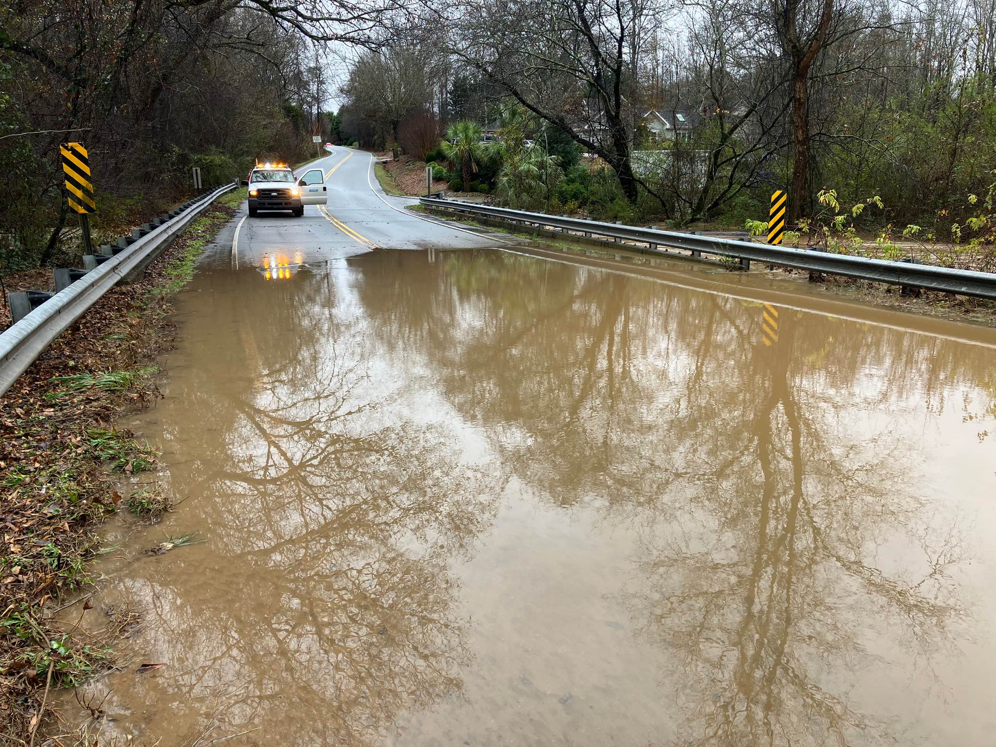 Officials closing roads due to flooding from morning rain