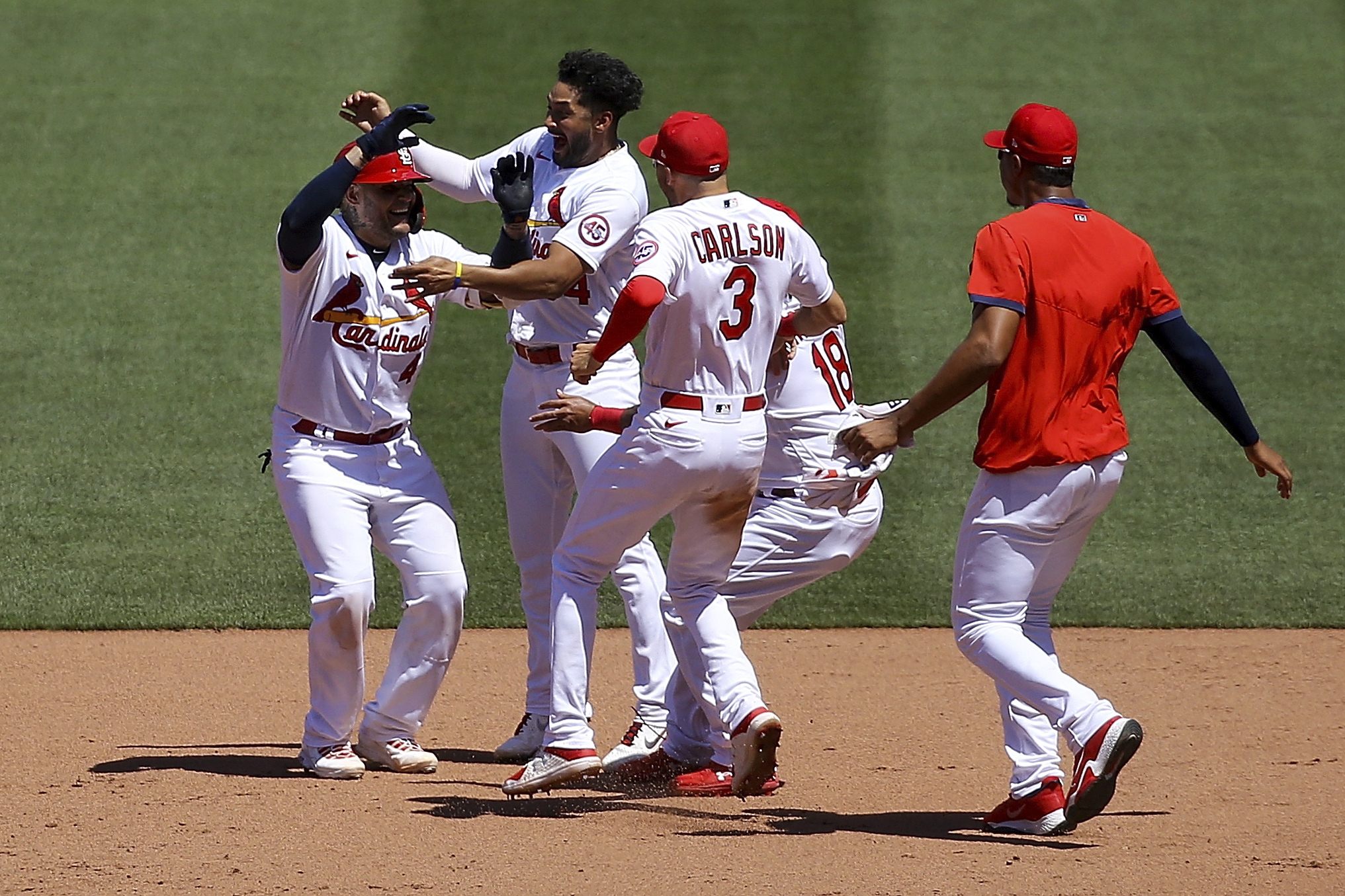 Miami Marlins' Jesus Sanchez, left, is congratulated by first base