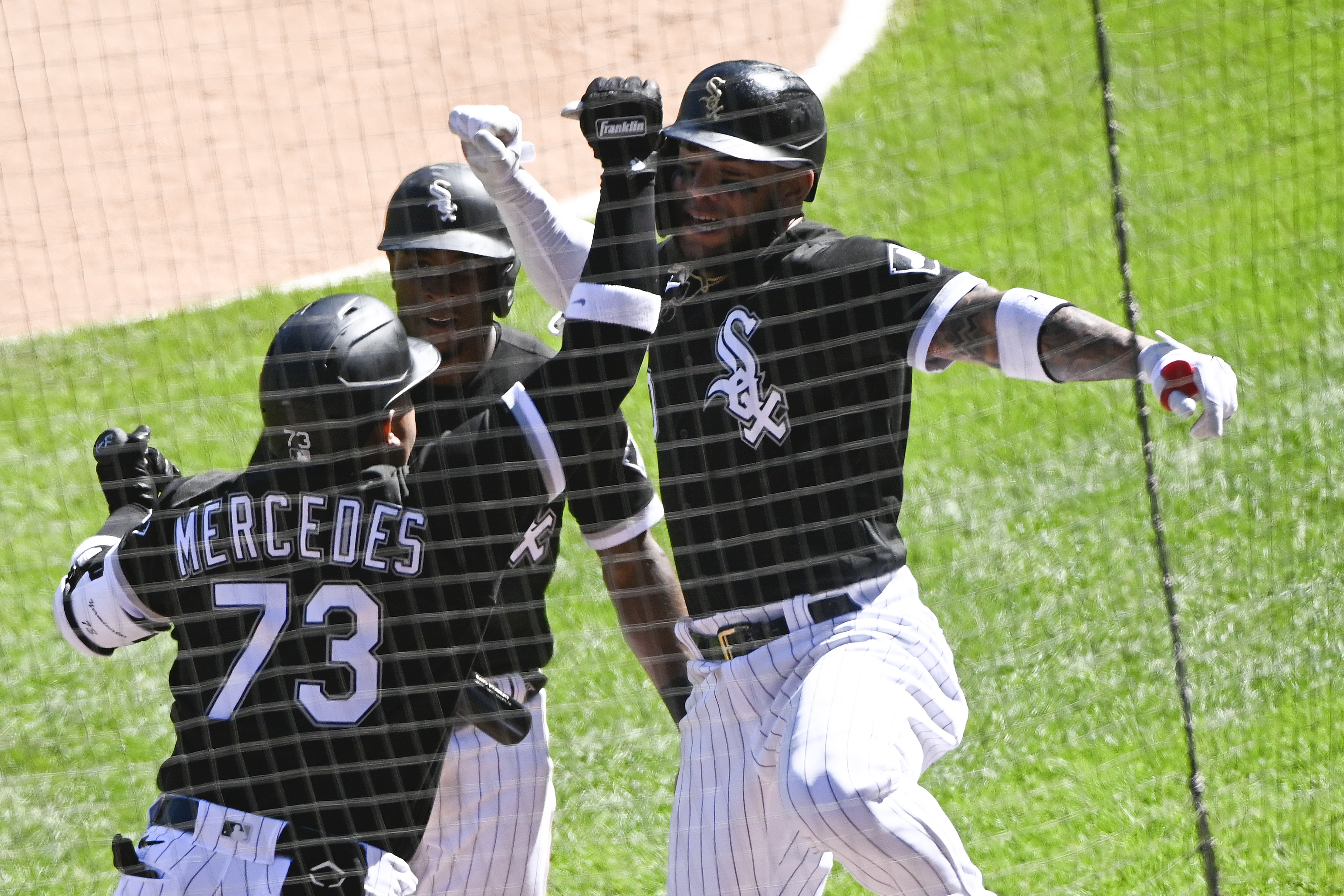 Chicago White Sox's Billy Hamilton (0) and Tim Anderson (7