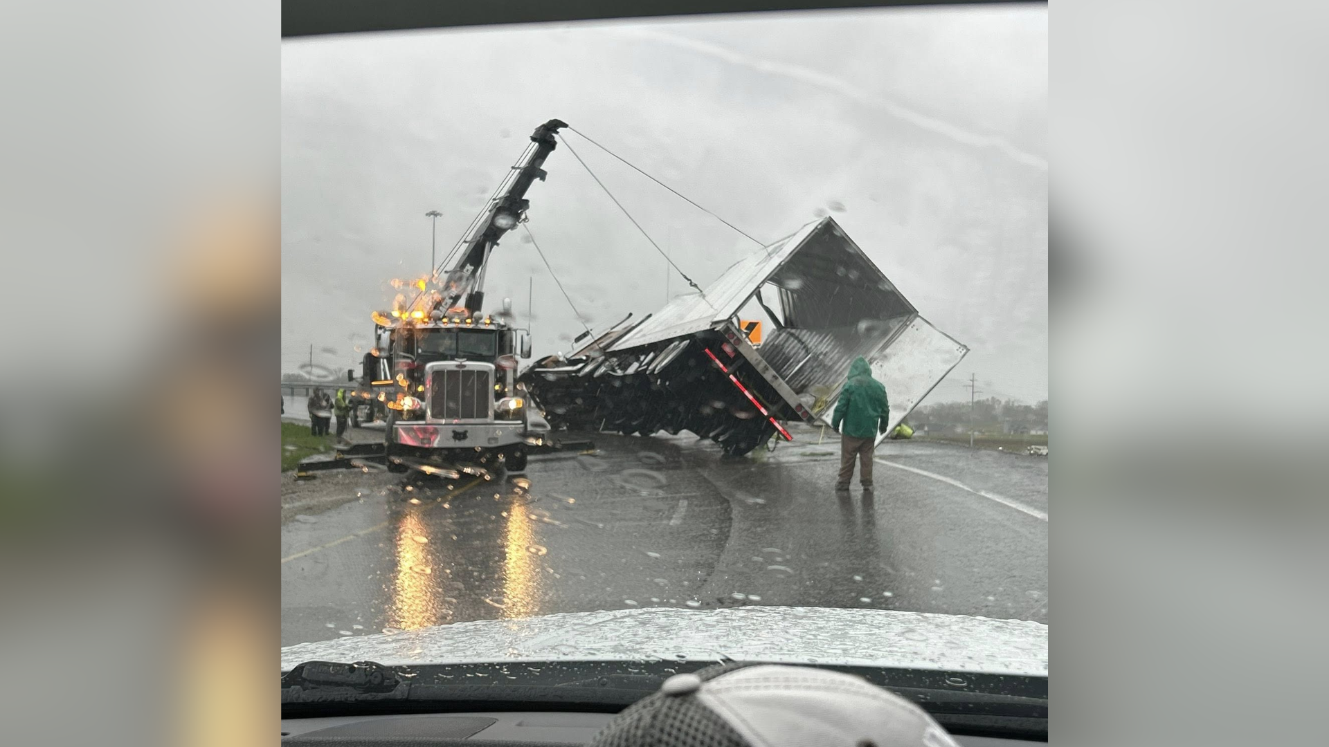Overturned semi carrying bibles blocks traffic on new curve in