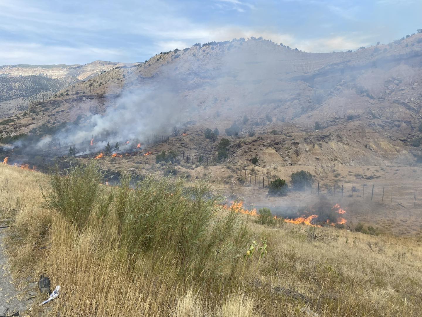 I-70 WB lane closed between Rifle and Parachute due to brush fire