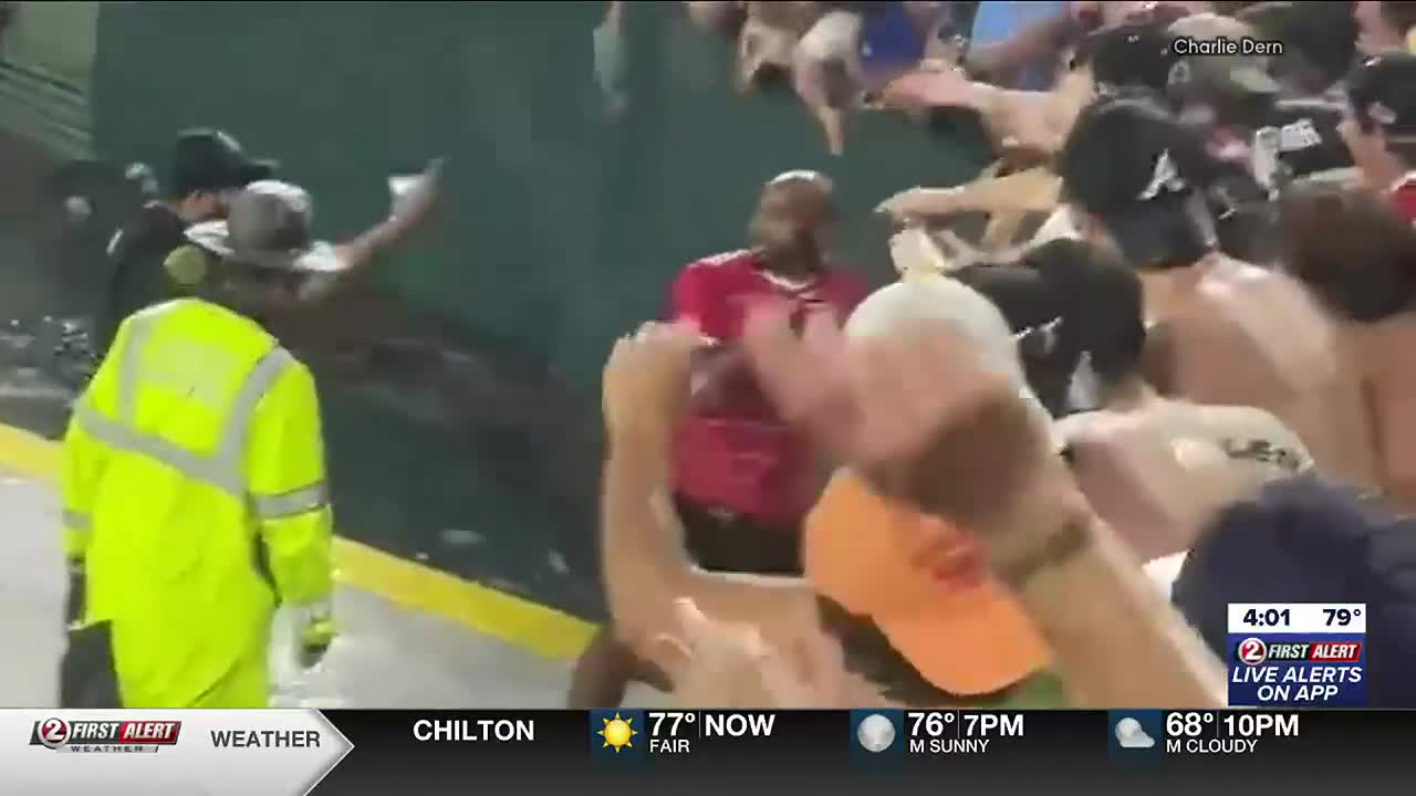 Dillon held back by security attempting Lambeau Leap