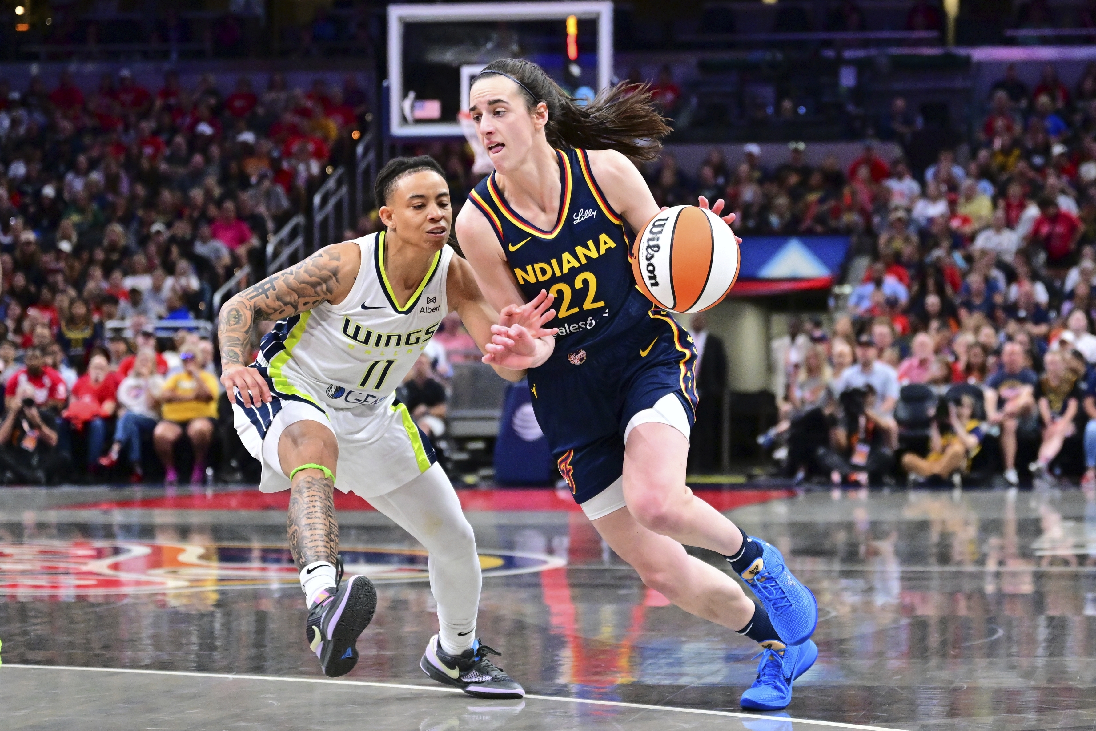 Caitlin Clark has 14 points and 13 assists as Fever beat Paige Bueckers and  Wings 102-83