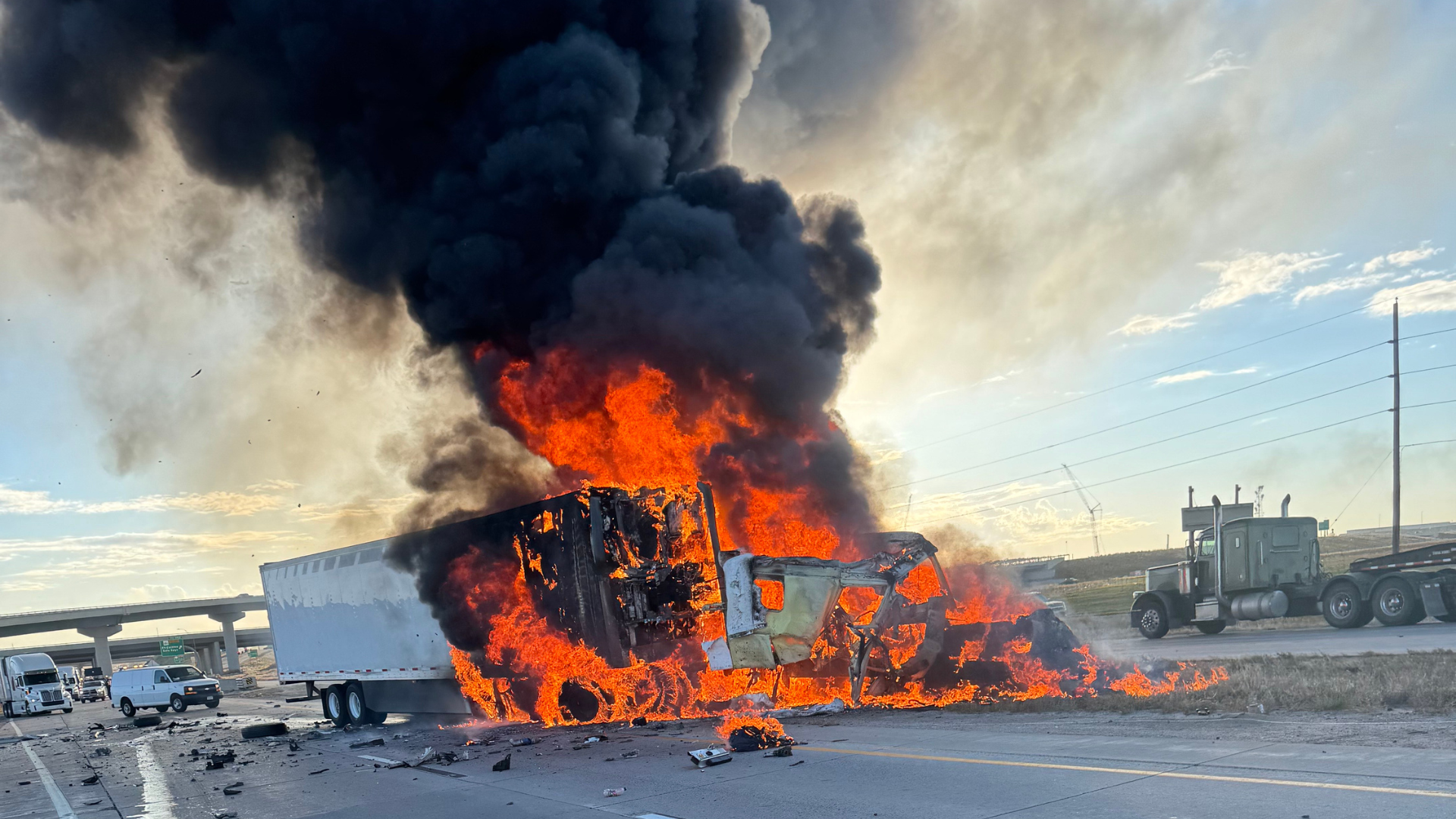 Two semis crash on I-70 one erupts in flames