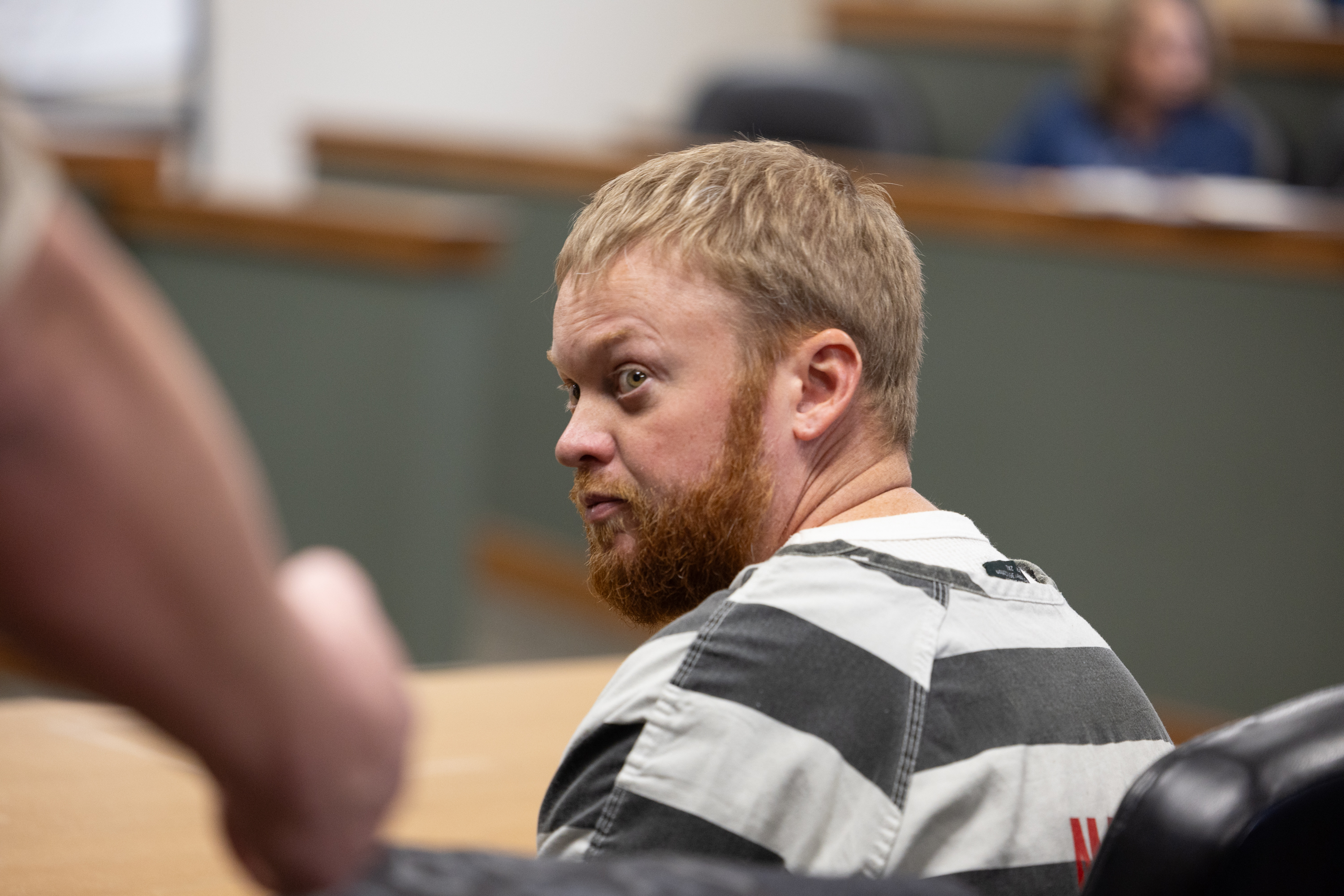 Man accused of paying to have romantic rival killed pleads