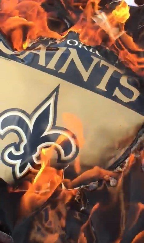 Saints fans burn memorabilia, boycott team after 10 players protest during  national anthem