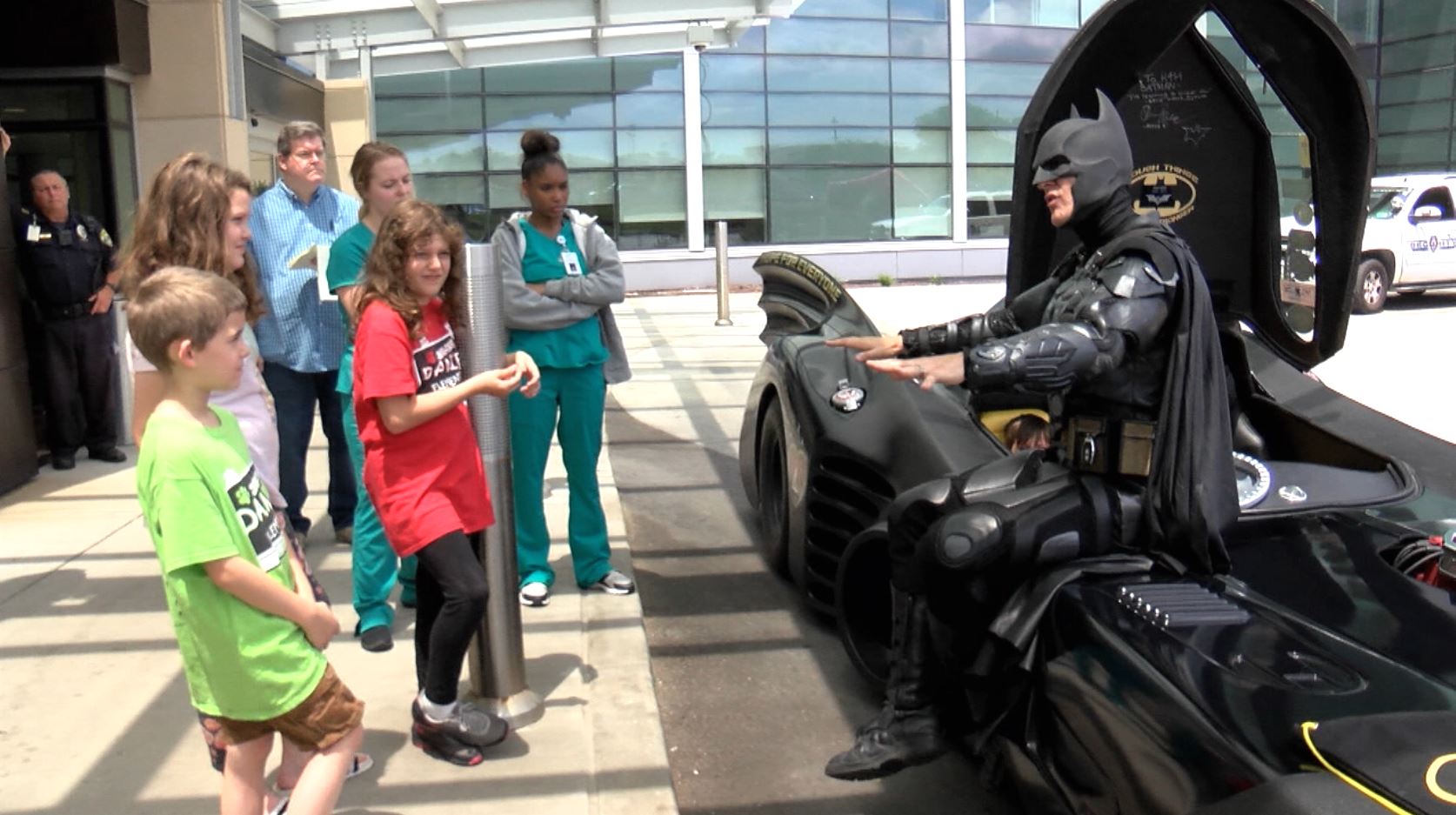 Batman talks to children at WVU Children's Hospital about never giving up
