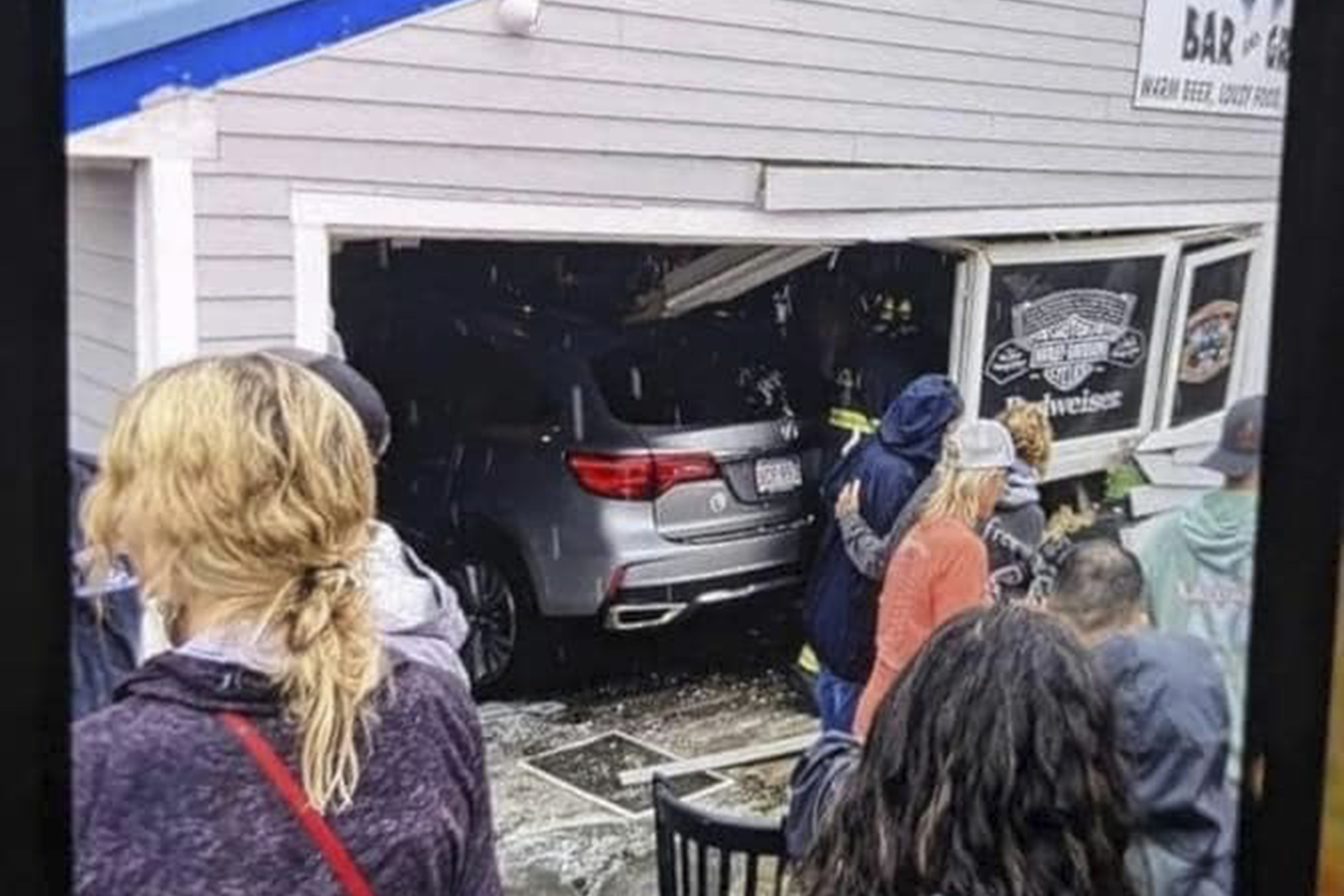 Car crashes into New Hampshire restaurant, injures dozens, pins