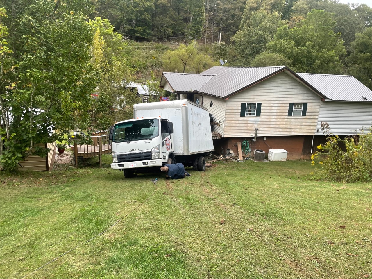 Truck Crashing Into House