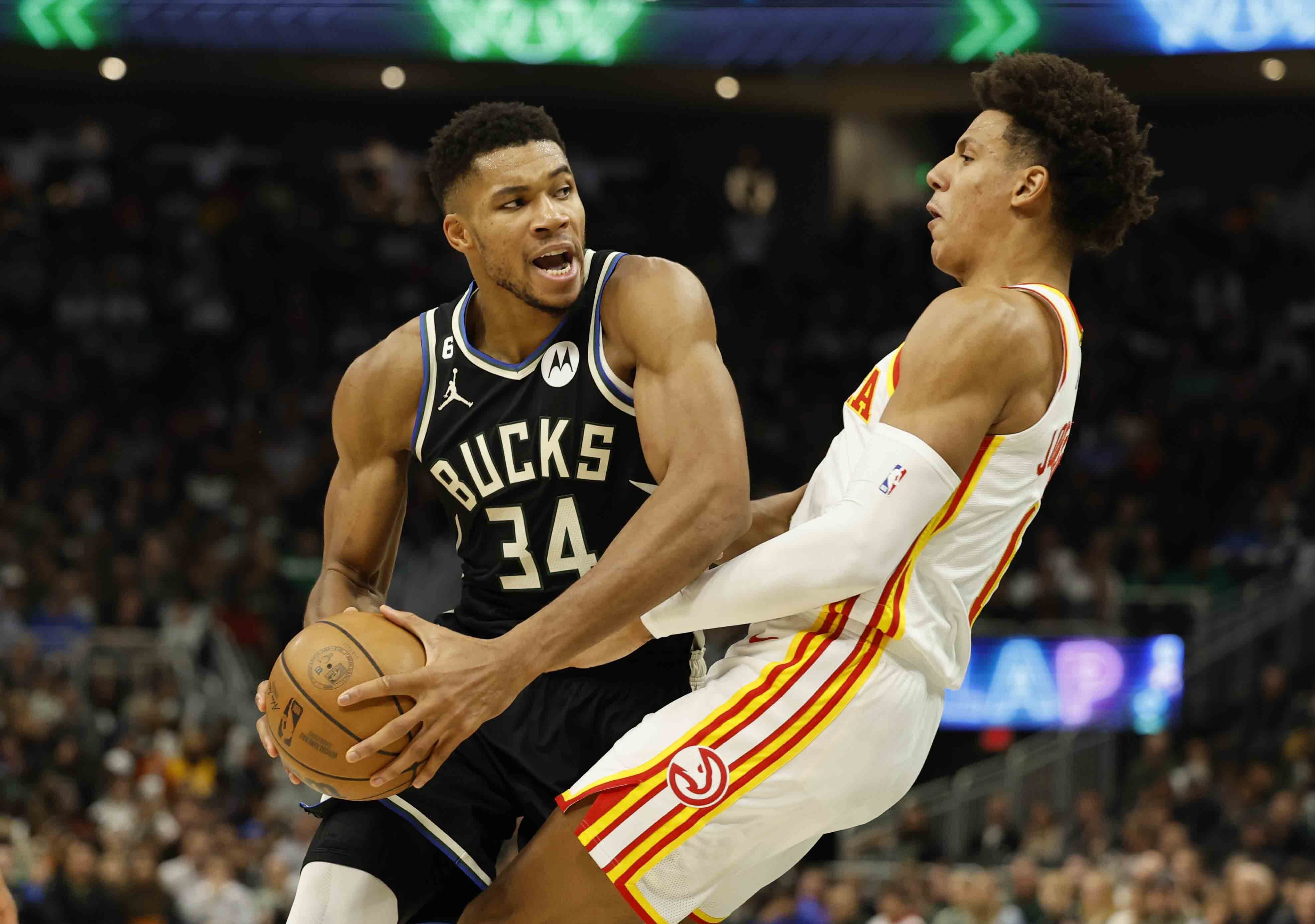 Portland Trail Blazers' Josh Hart (11) shoots over Milwaukee Bucks