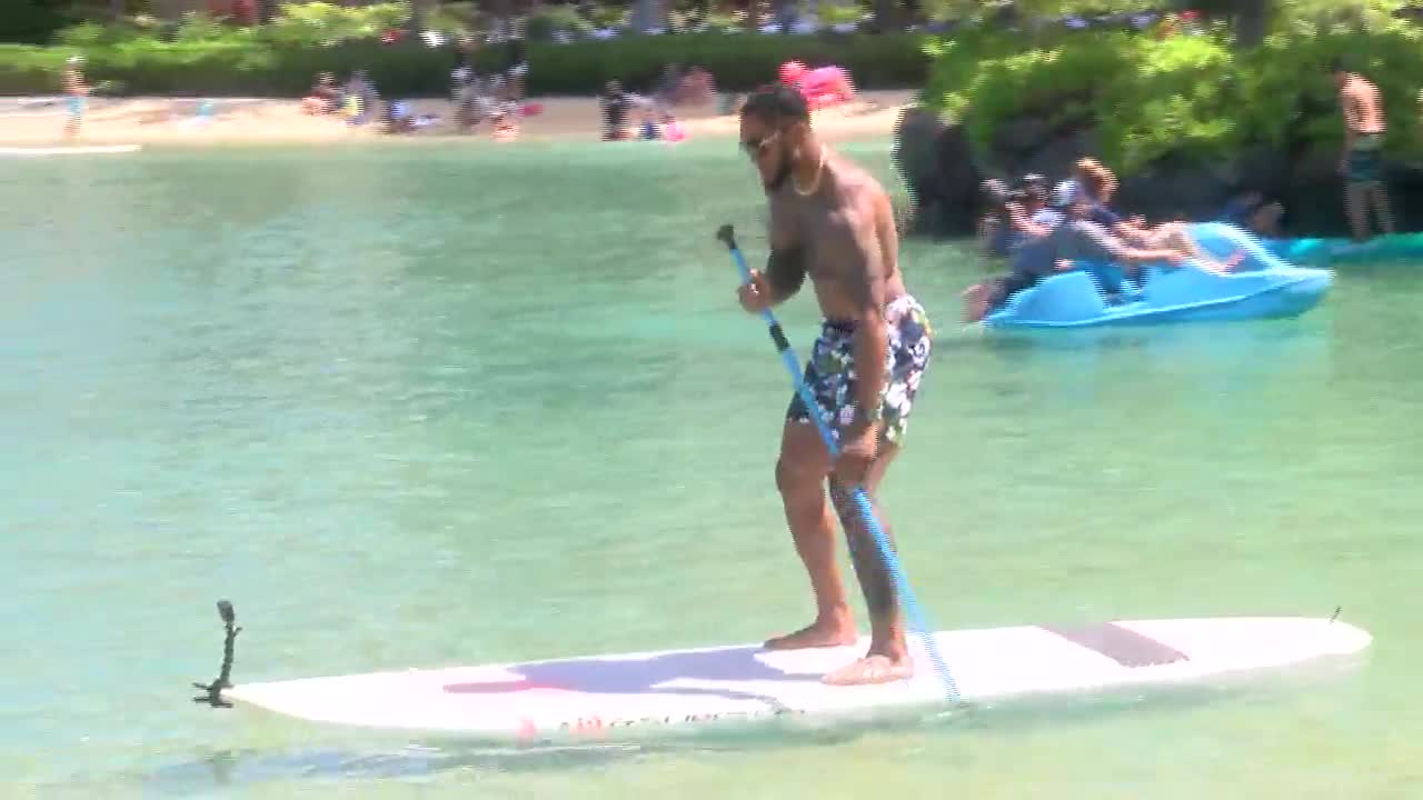 LA Rams safety John Johnson and cheerleaders hit the field with Hawaii youth