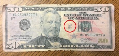 Counterfeit 50 Bills Found Circulating Marquette