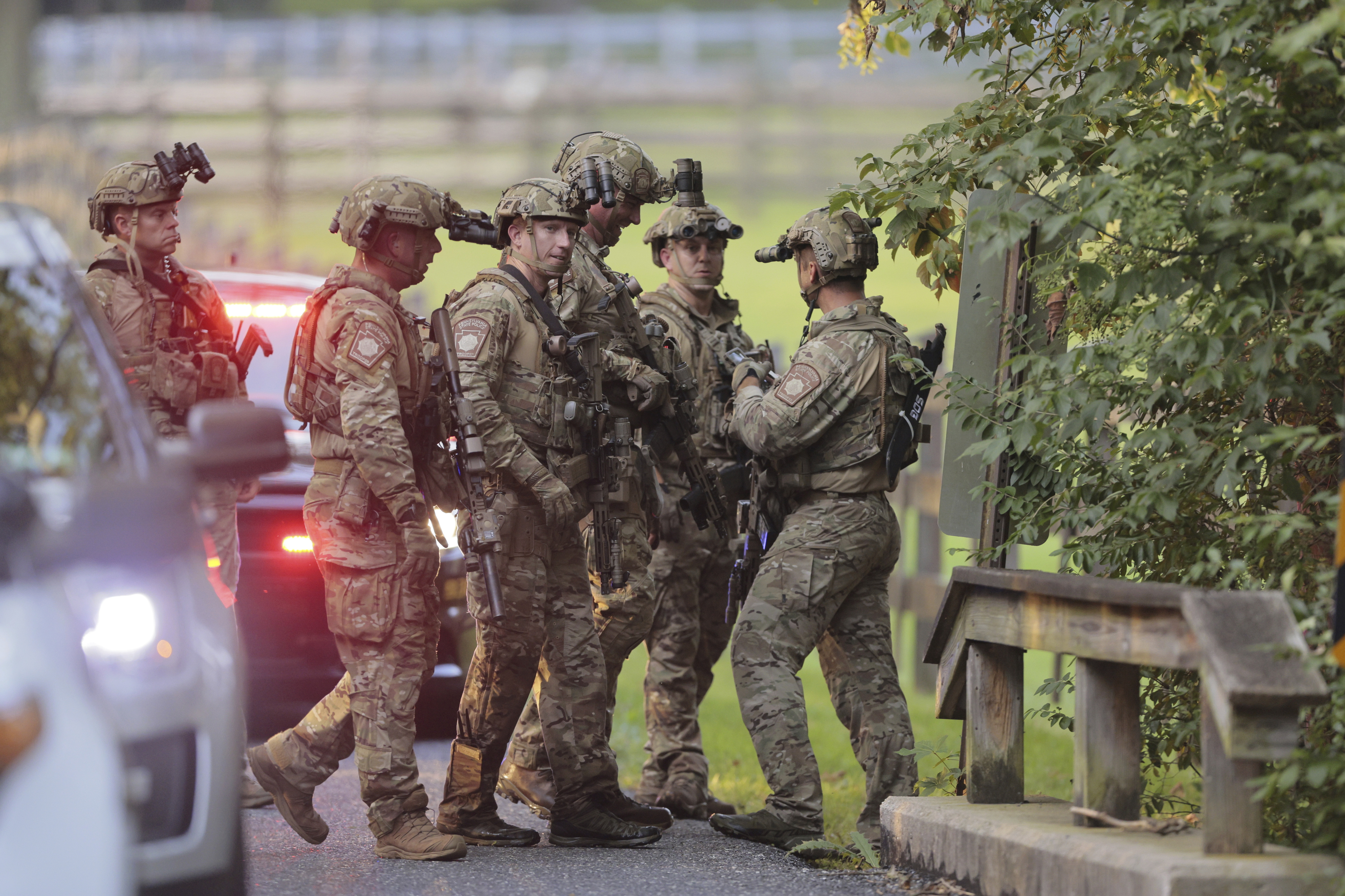 Heavily armed law enforcement officers move along Rt. 52 as the search  continues for Danilo Cavalcante in Pocopson Township, Pa., on Sunday, Sept.  3, 2023. Cavalcante escaped from the Chester County Prison.