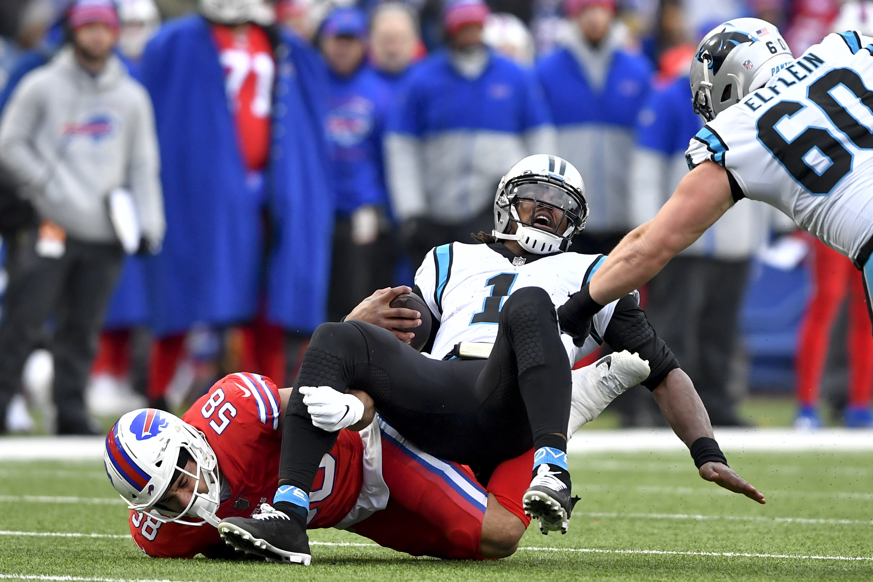 Cam Newton of the Carolina Panthers is sacked by Efe Obada of the