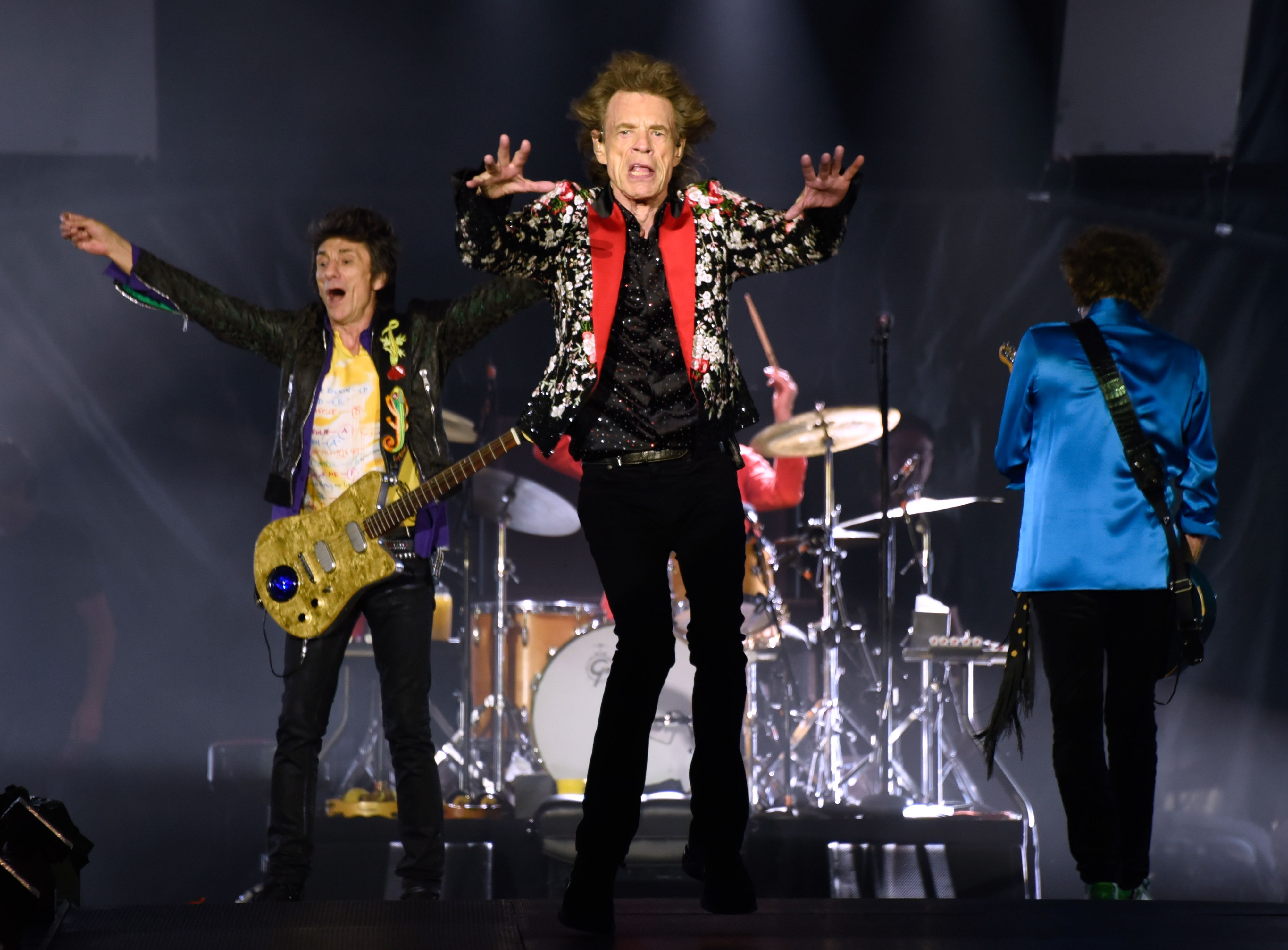 (FILES) In this file photo (From L) Ronnie Wood, Mick Jagger and Keith Richards of The Rolling Stones perform onstage at Hard Rock Stadium on August 30, 2019 in Miami Gardens, Florida. - The Rolling Stones on April 23, 2020 released their first new original music since 2012, a single aptly named "Living in a Ghost Town." Frontman Mick Jagger announced the surprise release on Twitter, saying, "The Stones were in the studio recording new material before the lockdown & one song -- Living In A Ghost Town -- we thought would resonate through the times we're living in." (Photo by Michele Eve Sandberg / AFP)