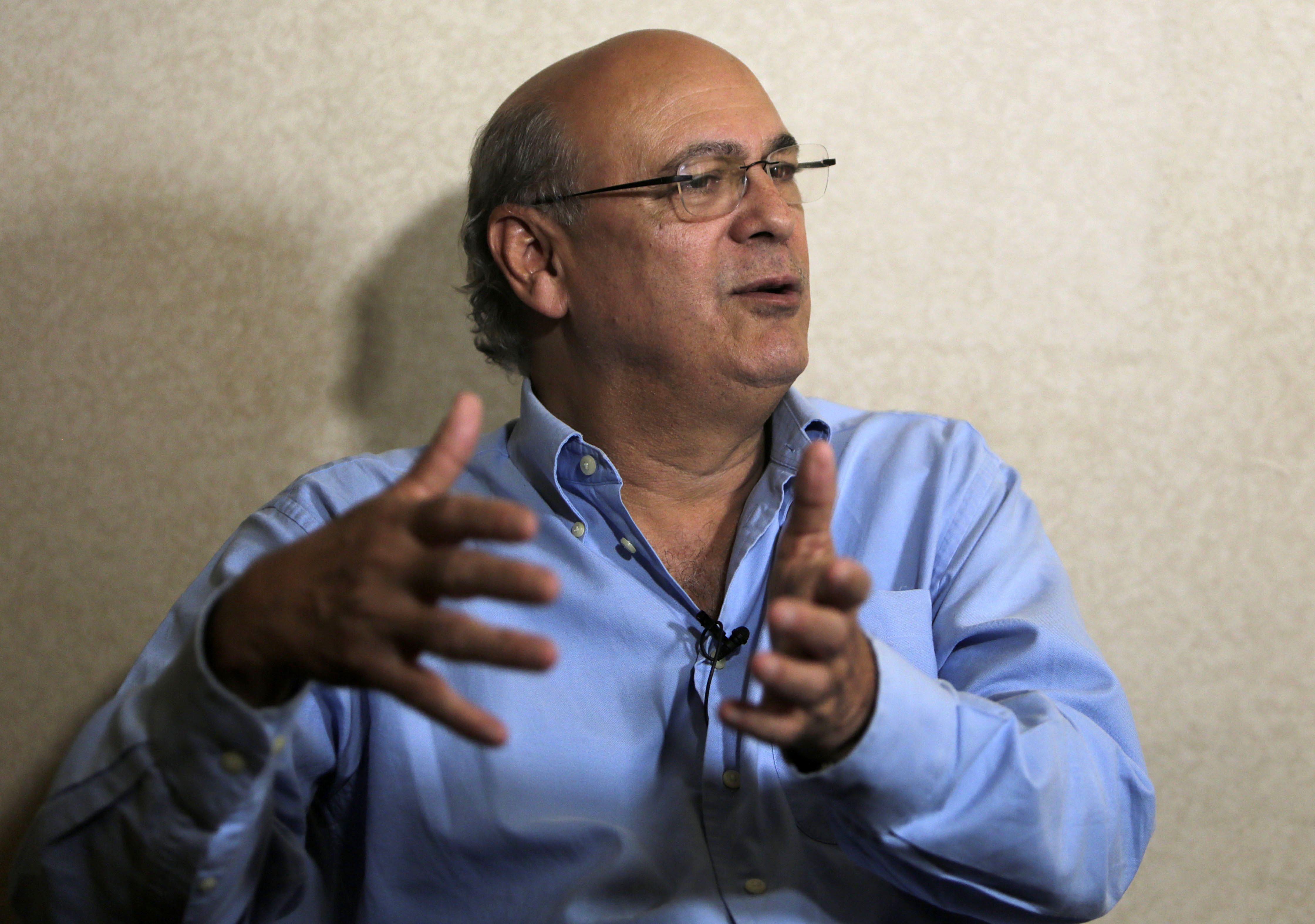 Journalist Carlos Fernando Chamorro gives an interview to AFP in Managua on December 18, 2018. - Nicaraguan police occupied the headquarters of opposition newspaper Confidencial and of civil and human rights organizations after they were stripped of their legal status, the affected groups denounced last Saturday. (Photo by Inti Ocon / AFP)