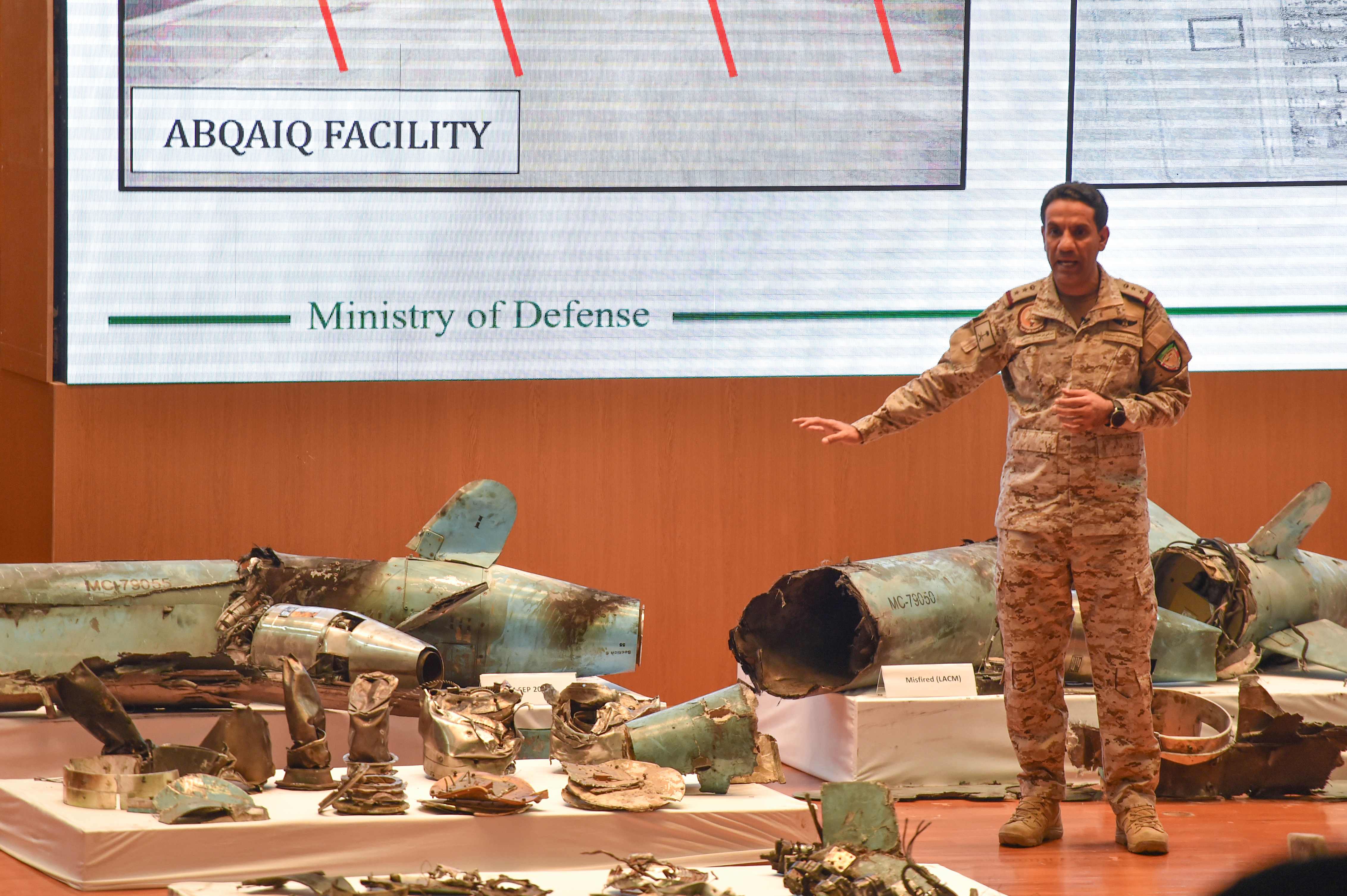 Saudi Colonel Turki bin Saleh al-Malki displays pieces of what he said were Iranian cruise missiles and drones recovered from the attack site that targeted Saudi Aramco's facilities, during a press conference in Riyadh on September 18, 2019. - Saudi Arabia said that strikes on its oil infrastructure came from the "north" and were sponsored by Iran, but that the kingdom was still investigating the exact launch site. (Photo by Fayez Nureldine / AFP)