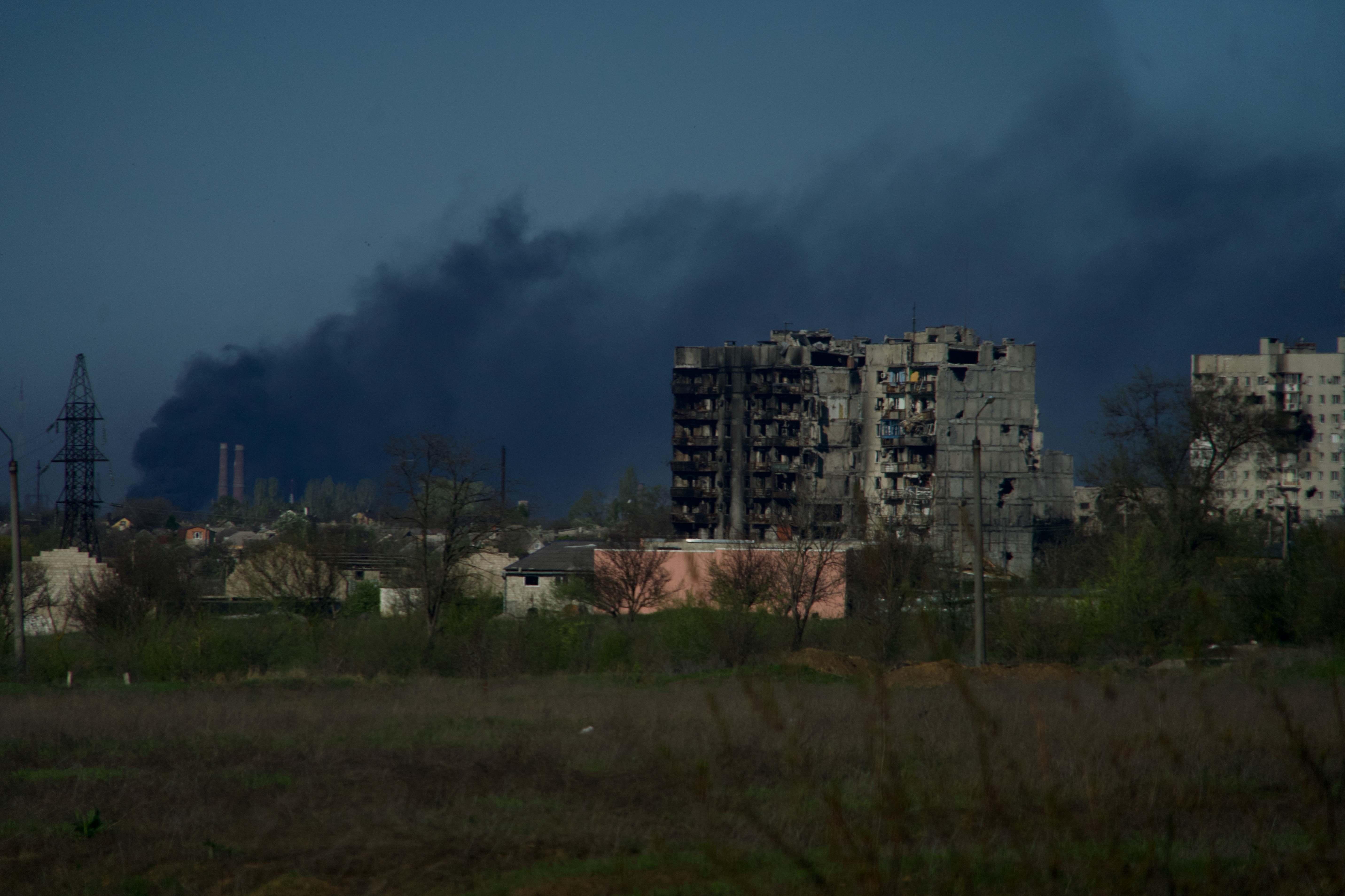Smoke rises from the grounds of the Azovstal steel plant in the city of Mariupol on April 29, 2022, amid the ongoing Russian military action in Ukraine. (Photo by Andrey BORODULIN / AFP)