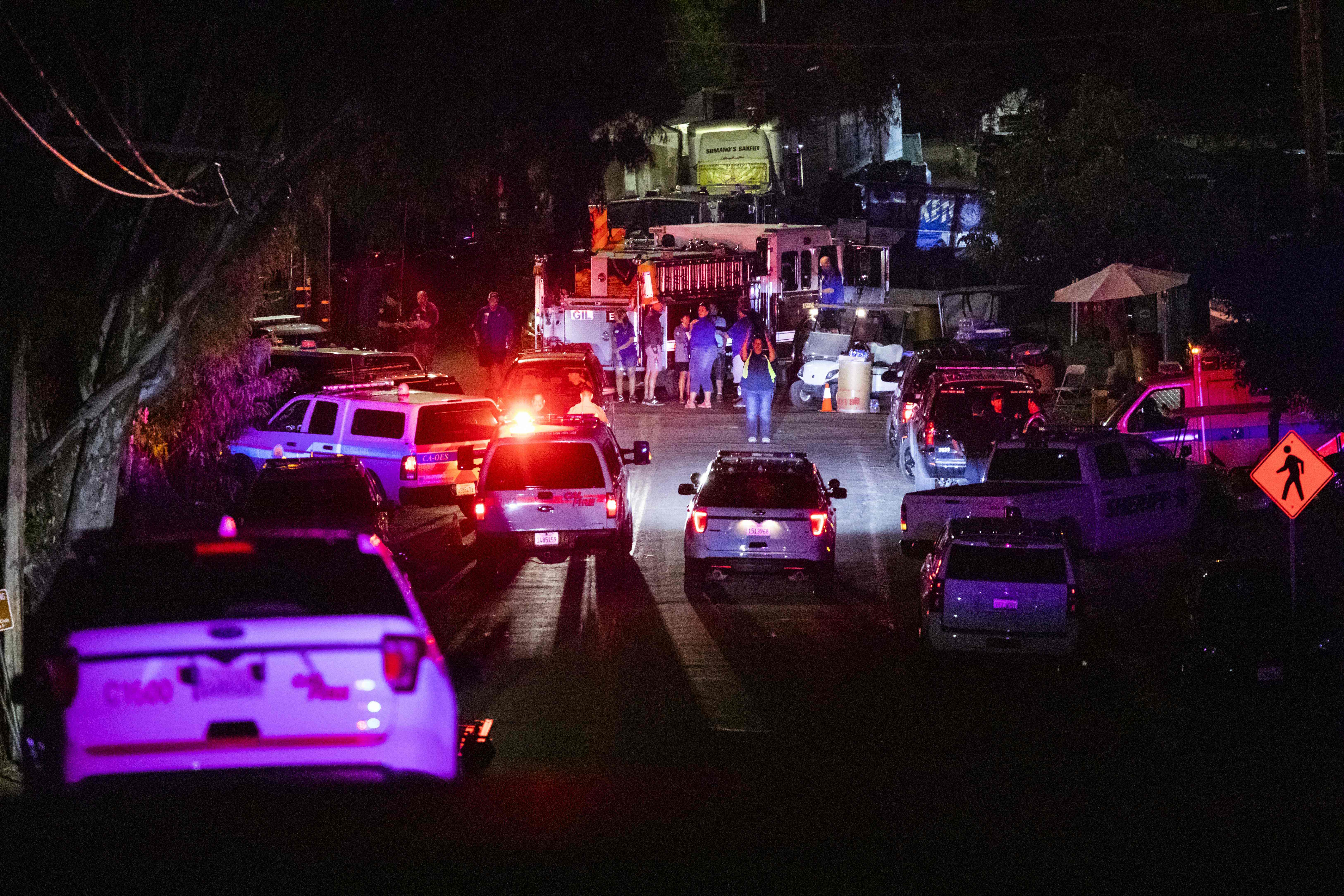 Police vehicles arrive on the scene of the investigation following a deadly shooting at the Gilroy Garlic Festival in Gilroy, 80 miles south of San Francisco, California on July 28, 2019. - Three people were killed and at least 15 others injured in a shooting at a major food festival in California on Sunday, police said. Officers confronted and shot dead the suspect "in less than a minute," said Scot Smithee, police chief of the city of Gilroy, 30 miles (48 kilometers) southeast of San Jose. (Photo by Philip Pacheco / AFP)