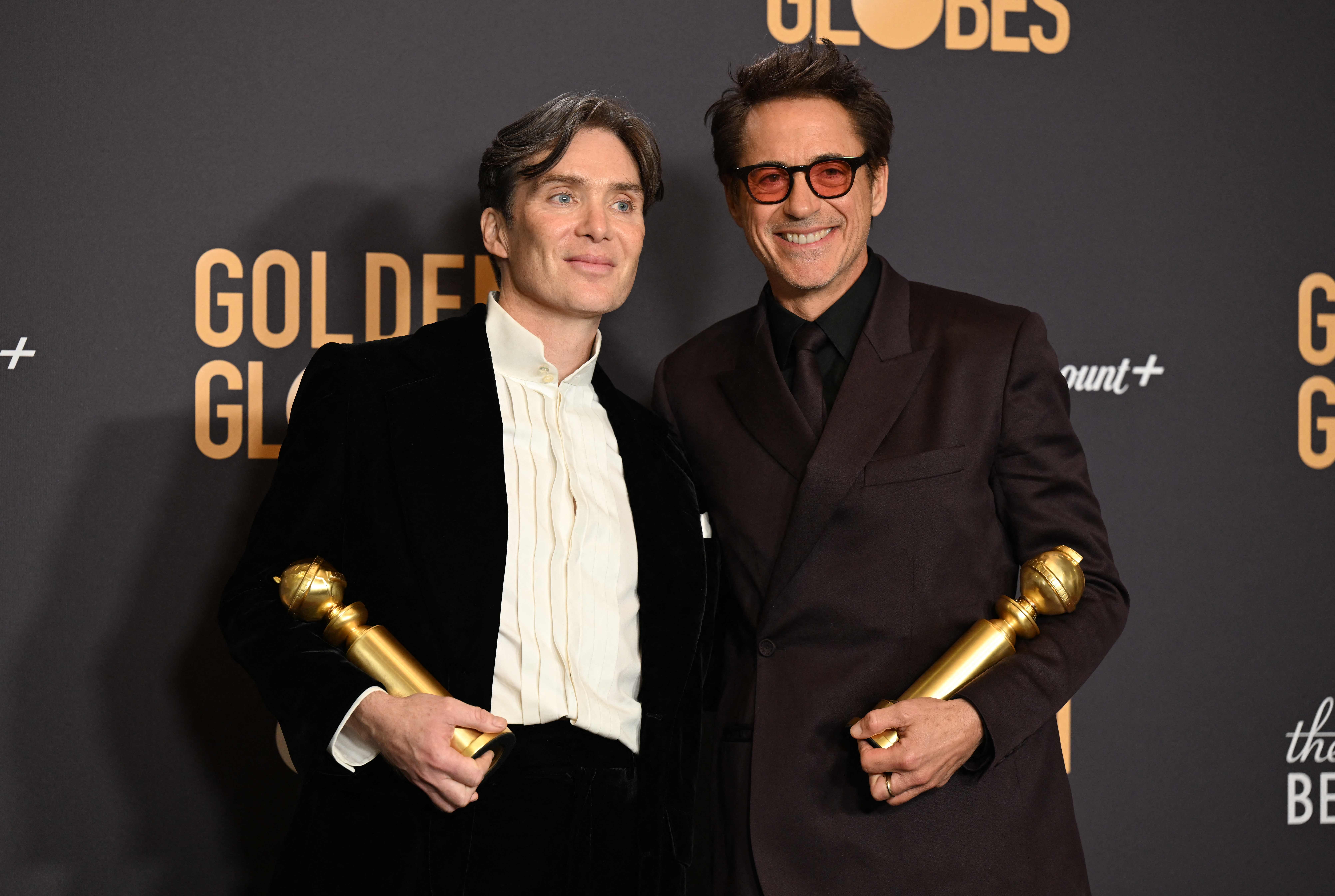 TOPSHOT - Irish actor Cillian Murphy (L) and US actor Robert Downey Jr. pose in the press room with the awards for Best Performance by a Male Actor in a Motion Picture - Drama and Best Performance by a Male Actor in a Supporting Role in any Motion Picture during the 81st annual Golden Globe Awards at The Beverly Hilton hotel in Beverly Hills, California, on January 7, 2024. (Photo by Robyn BECK / AFP)