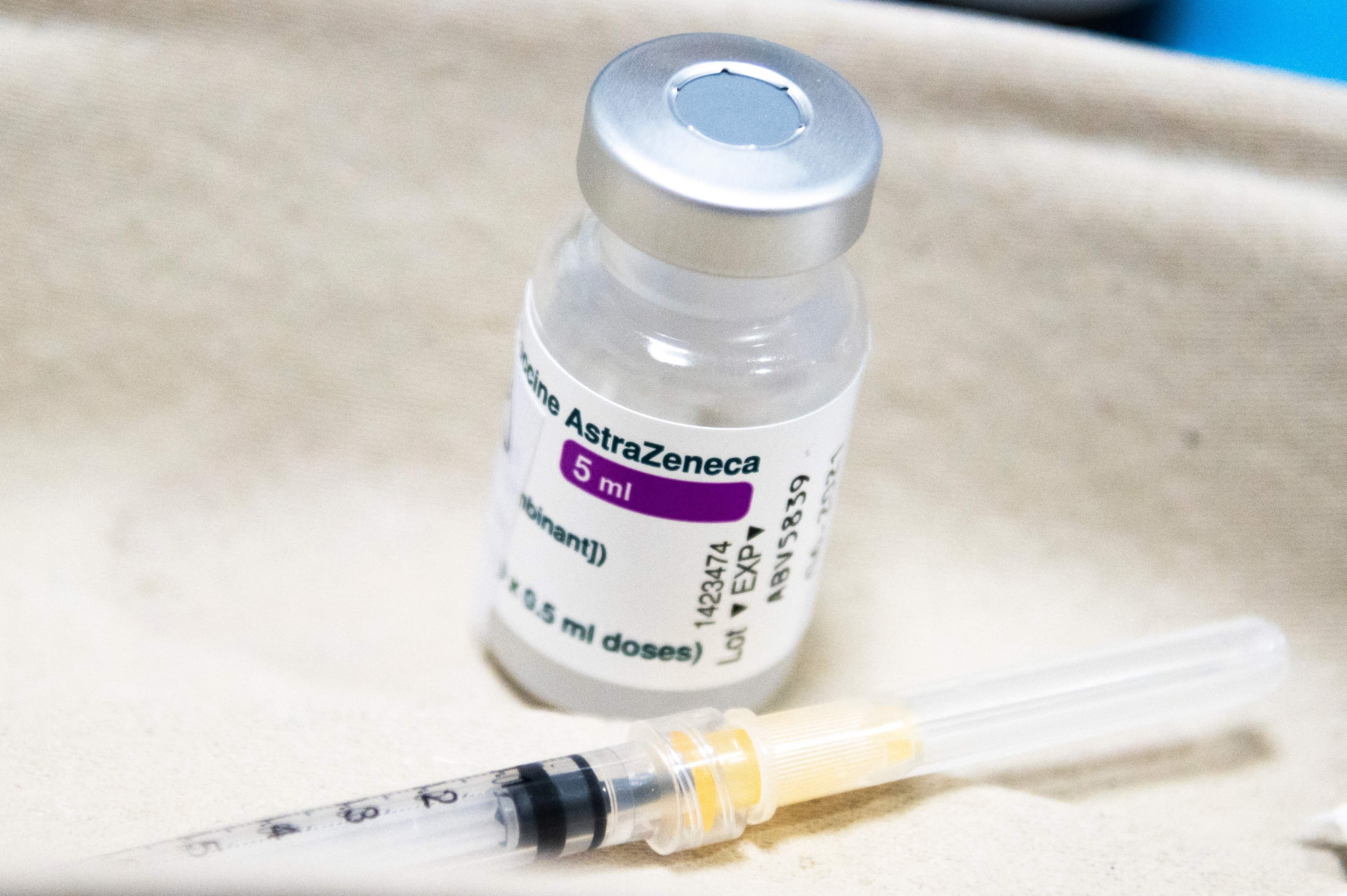 A syringe and a vial of the AstraZeneca vaccine against Covid-19 are pictured on March 19, 2021 at the San Giovanni Bosco Hospital in Turin. - Italy on March 19, 2021 again began administering AstraZeneca vaccines, five days after suspending the programme over safety fears despite the worsening coronavirus situation. The European Medicines Agency (EMA) on March 18 declared the jab "safe and effective", and Italy's AIFA regulator subsequently lifted its nationwide ban. (Photo by Marco Bertorello / AFP)