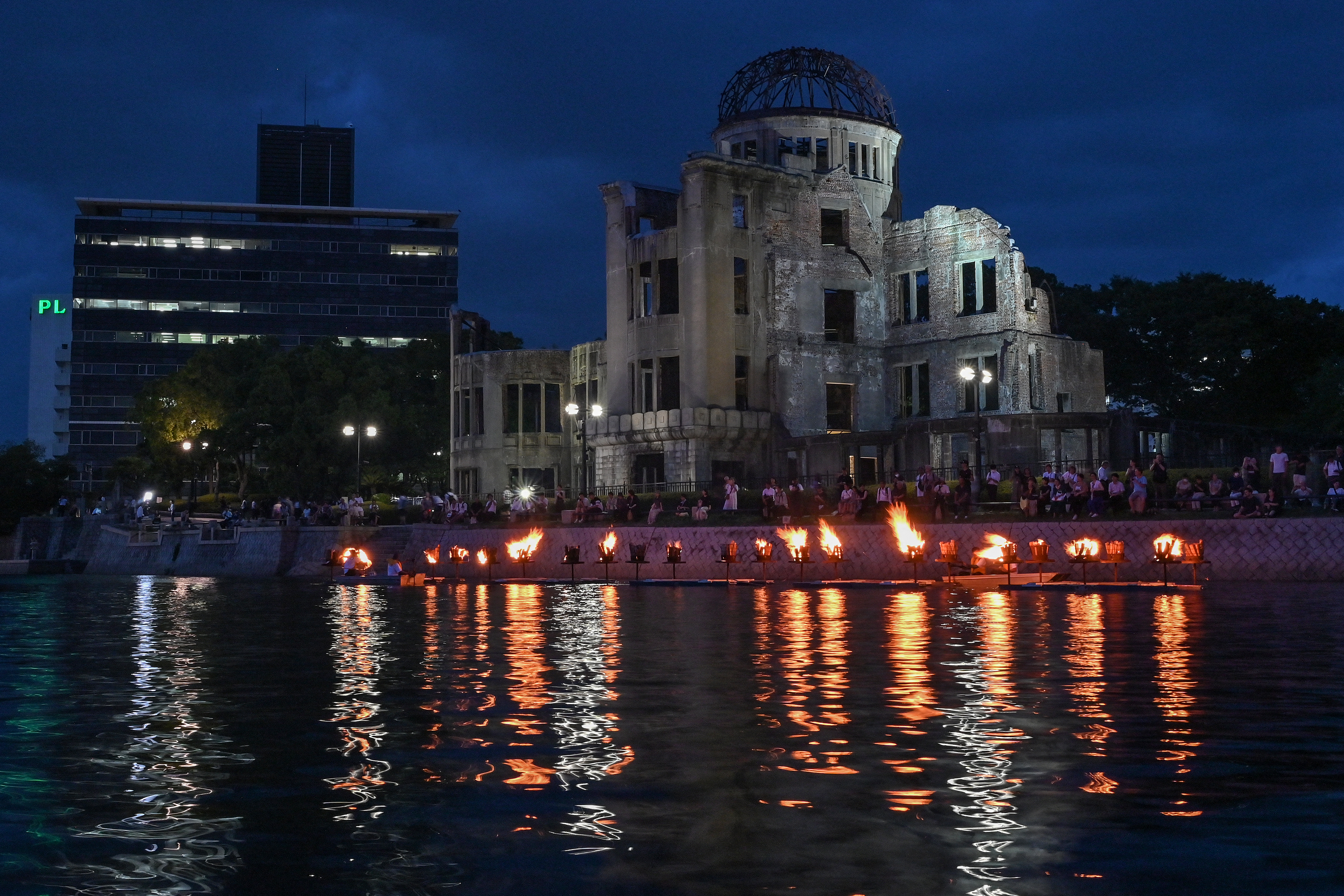 Doves are released after the Peace Declaration during the annual memorial ceremony at the Hiroshima Peace Memorial Park in Hiroshima on August 6, 2025, to mark 80 years since the world's first atomic bomb attack. (Photo by JIJI Press / AFP) / Japan OUT / JAPAN OUT / JAPAN OUT