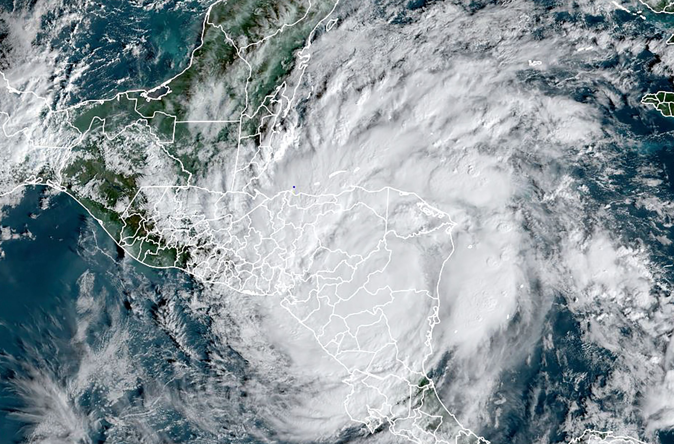 This RAMMB/NOAA satellite image shows Hurricane Iota over Central America on November 17, 2020, at 13:0 UTC over Central America. - Hurricane Iota was barreling through Central America on November 17, 2020, hours after making landfall as the strongest Atlantic storm this year along a stretch of Nicaraguan coast devastated by a powerful storm just two weeks ago. Authorities rushed to evacuate thousands of people from coastal areas of Nicaragua and Honduras in the immediate path of the storm. US forecasters at the National Hurricane Center warned of "life-threatening storm surge, catastrophic winds, flash flooding, and landslides" in Central America. (Photo by Handout / RAMMB/NOAA/NESDIS / AFP) / RESTRICTED TO EDITORIAL USE - MANDATORY CREDIT "AFP PHOTO / RAMMB/NOAA" - NO MARKETING - NO ADVERTISING CAMPAIGNS - DISTRIBUTED AS A SERVICE TO CLIENTS