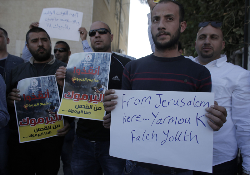 Palestinos manifiestan su apoyo, en Jerusalén, a Yarmuk. | AFP