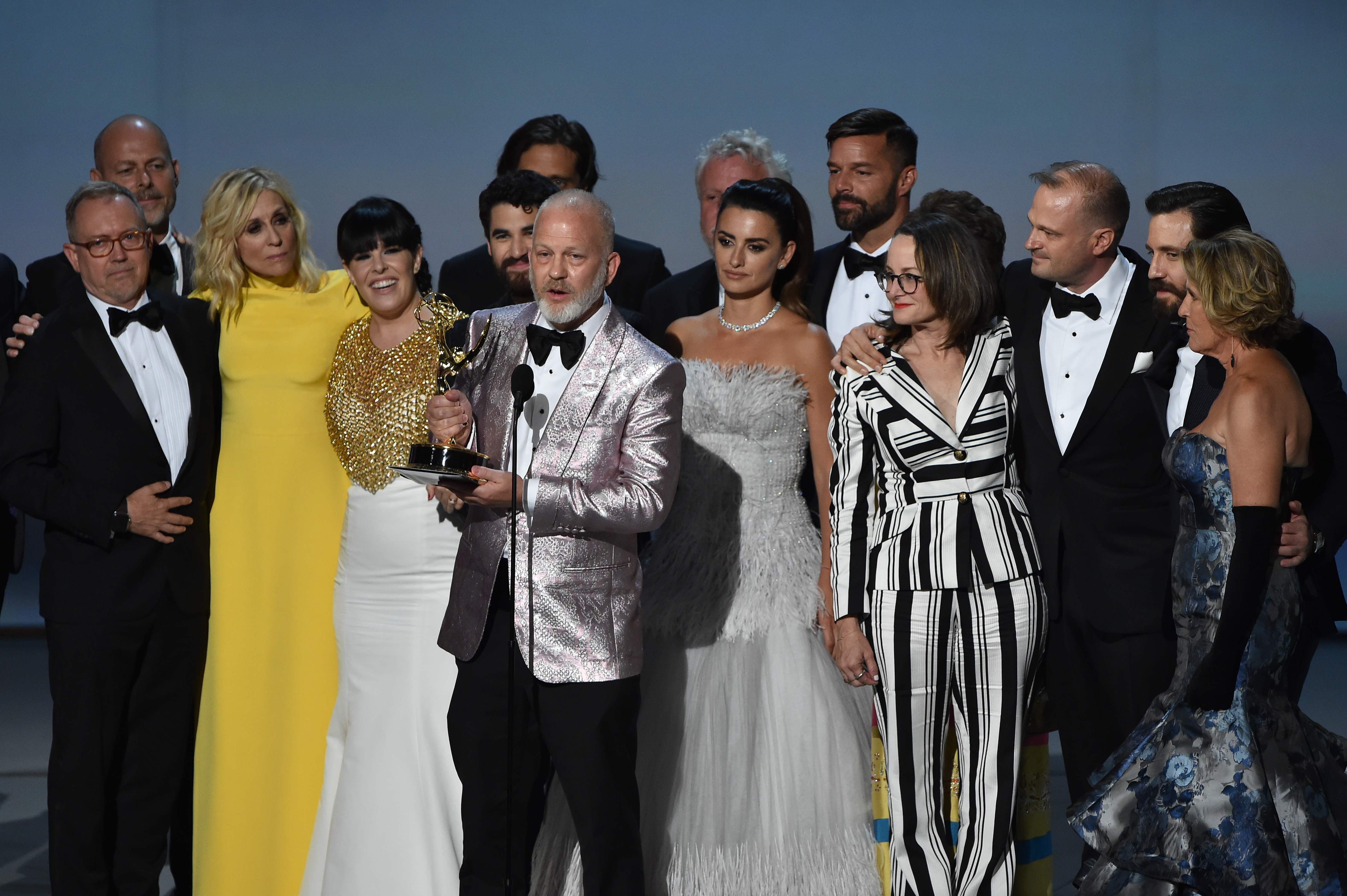 Ryan Murphy (C) and cast and crew accepts the Outstanding Limited Series award for 'The Assassination of Gianni Versace: American Crime Story' speak onstage during the 70th Emmy Awards at the Microsoft Theatre in Los Angeles, California on September 17, 2018. (Photo by Robyn BECK / AFP)